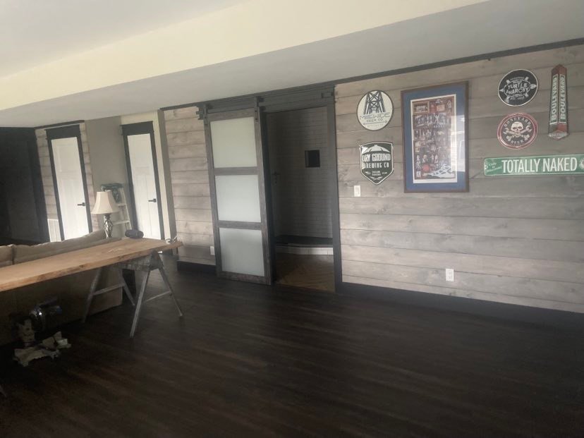   Chris and Monica picked up 1,300 sq ft of 1x8 shiplap. It was gray washed with Benjamin Moore Revere Pewter. They came back and stain washed it with Classic Gray with some Ebony mixed in. She said her arm hurt for a while after all of it, but it cl