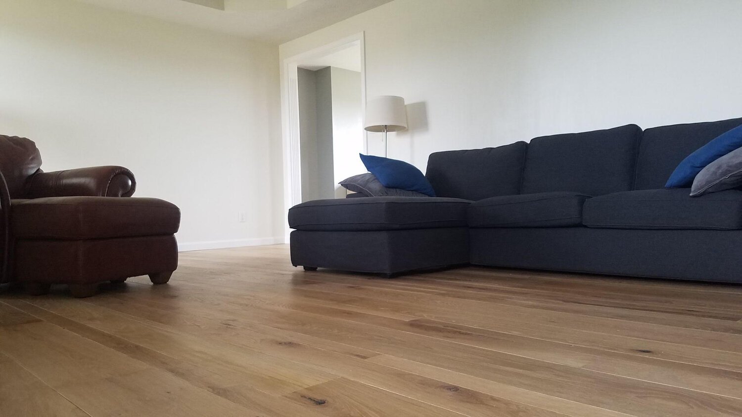  Todd visited us in February of this year to pick up a trailer full of white oak flooring for his living room remodel. This was to be his first experience installing hardwood, so he had some reservations initially, but after a few phone calls back an