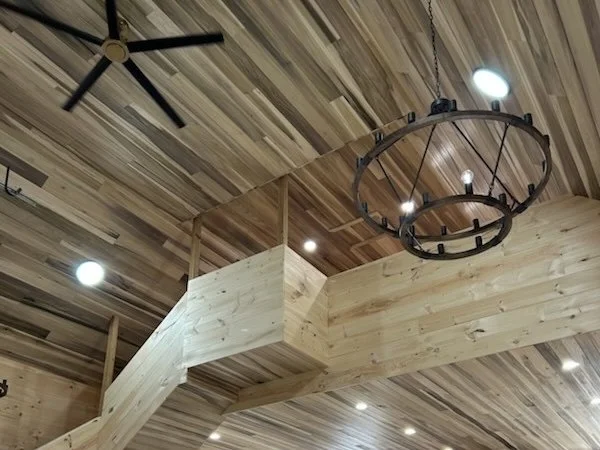 Rainbow poplar tongue and groove ceiling installed in a finished living space.
