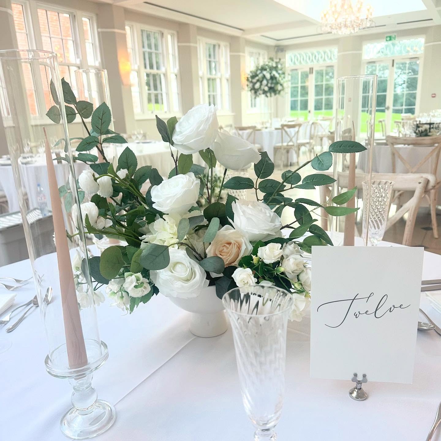 A gorgeous low level arrangement can still provide all the styling impact you desire. 

Our beautiful ceramic footed vase centrepieces give a modern elegance to your wedding day, a timeless design that is ever so popular at the moment 

These arrange