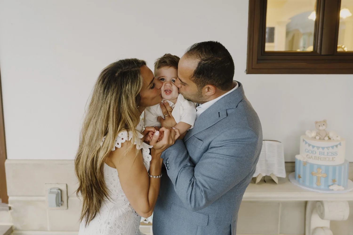 Gabriele receiving kisses on both cheeks during the celebration at home