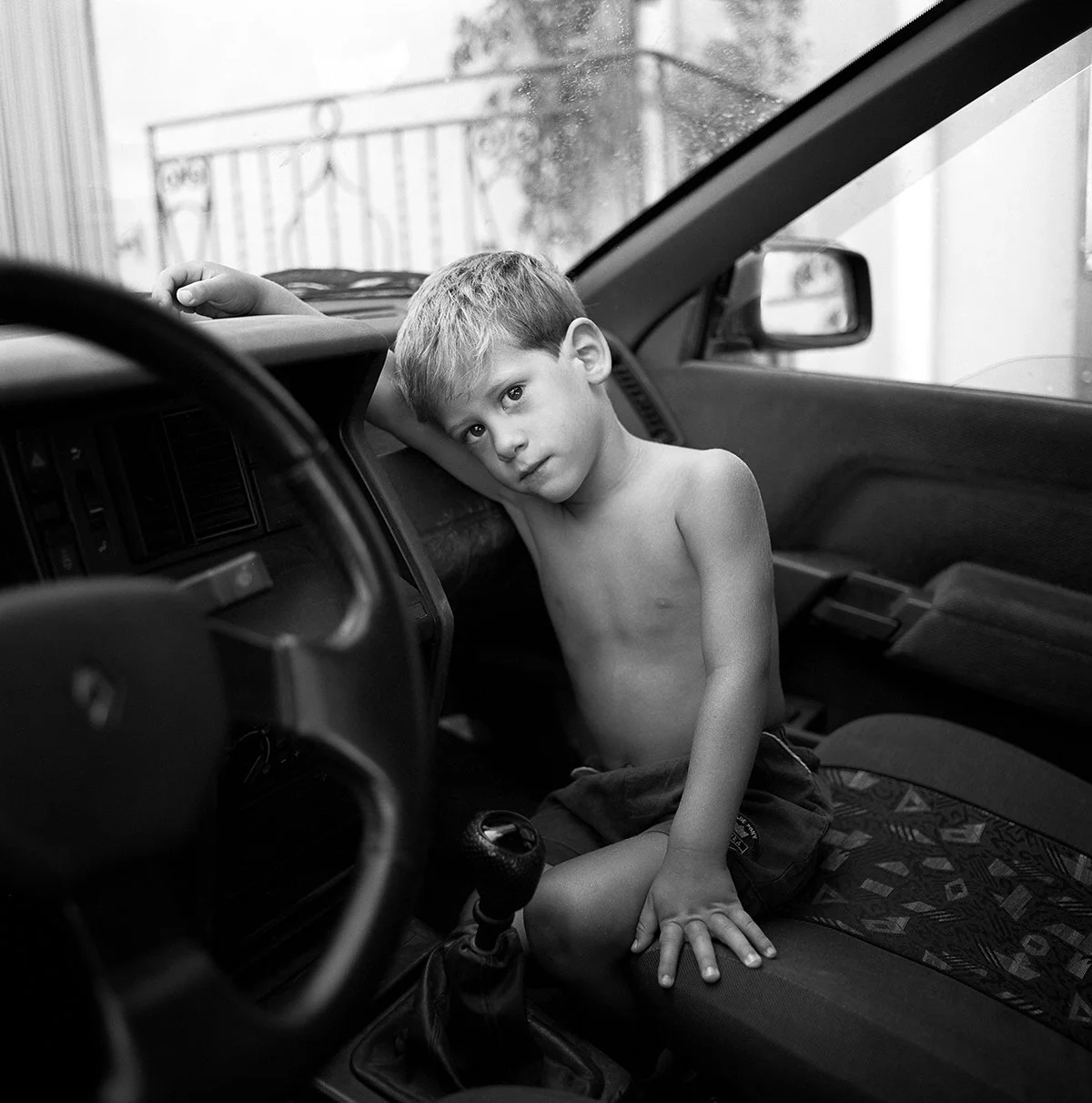 Boy in car Sicily.jpg