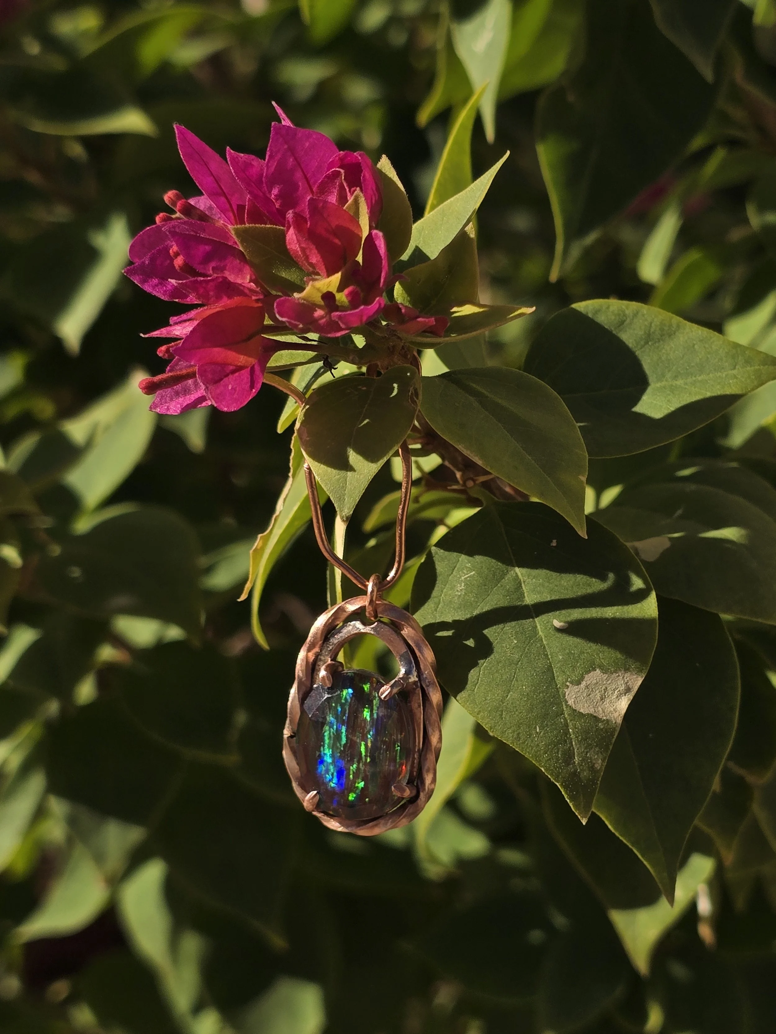 Aurora opal set on a copper back