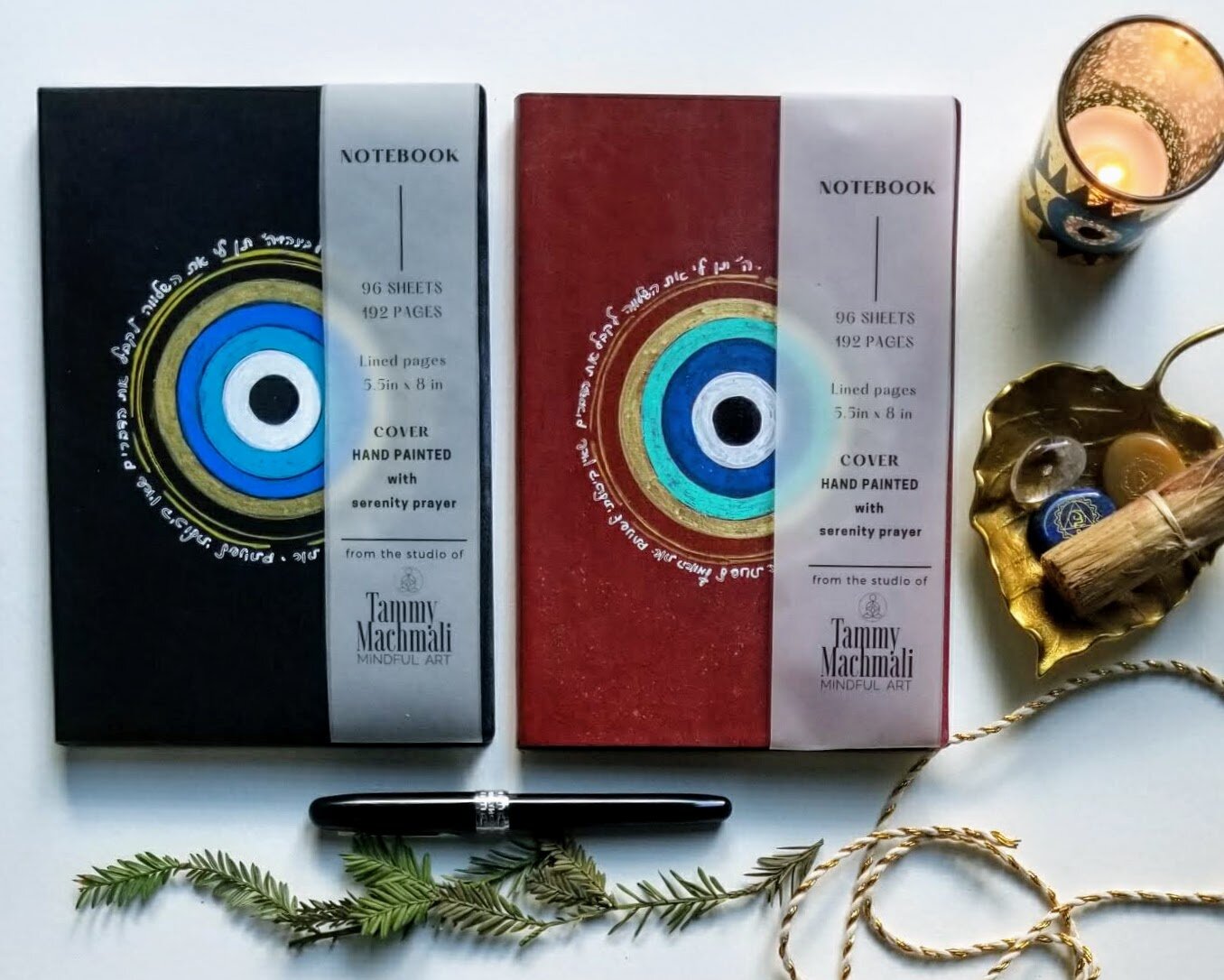 Each notebook cover is hand painted with gold, blue, teal, deep blue and black oils giving these pieces a subtle festive spark. Hebrew serenity prayer is around the evil eye by tammy machmali.jpg