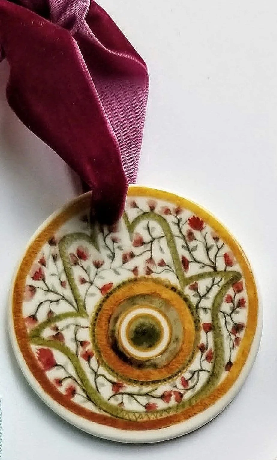 Terracotta floral hamsa  ceramic ornament is a print of an original hand painted floral watercolor hamsa with gold, blue