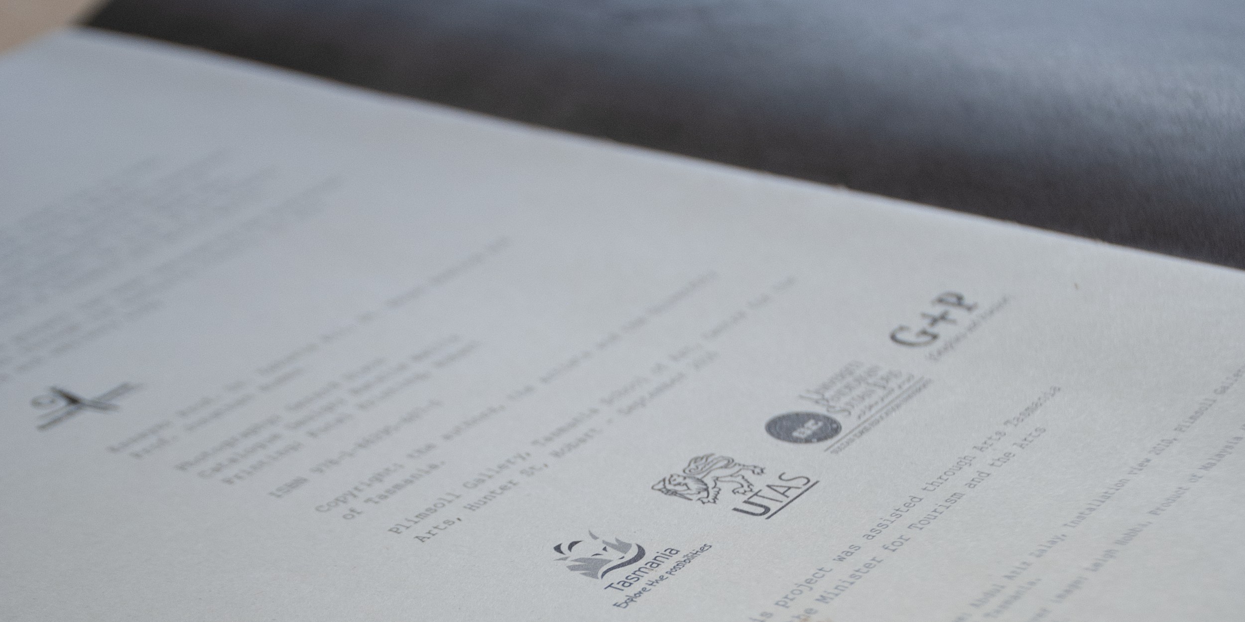 A close-up page of the catalogue containing the logos and other details of the organisations involved
