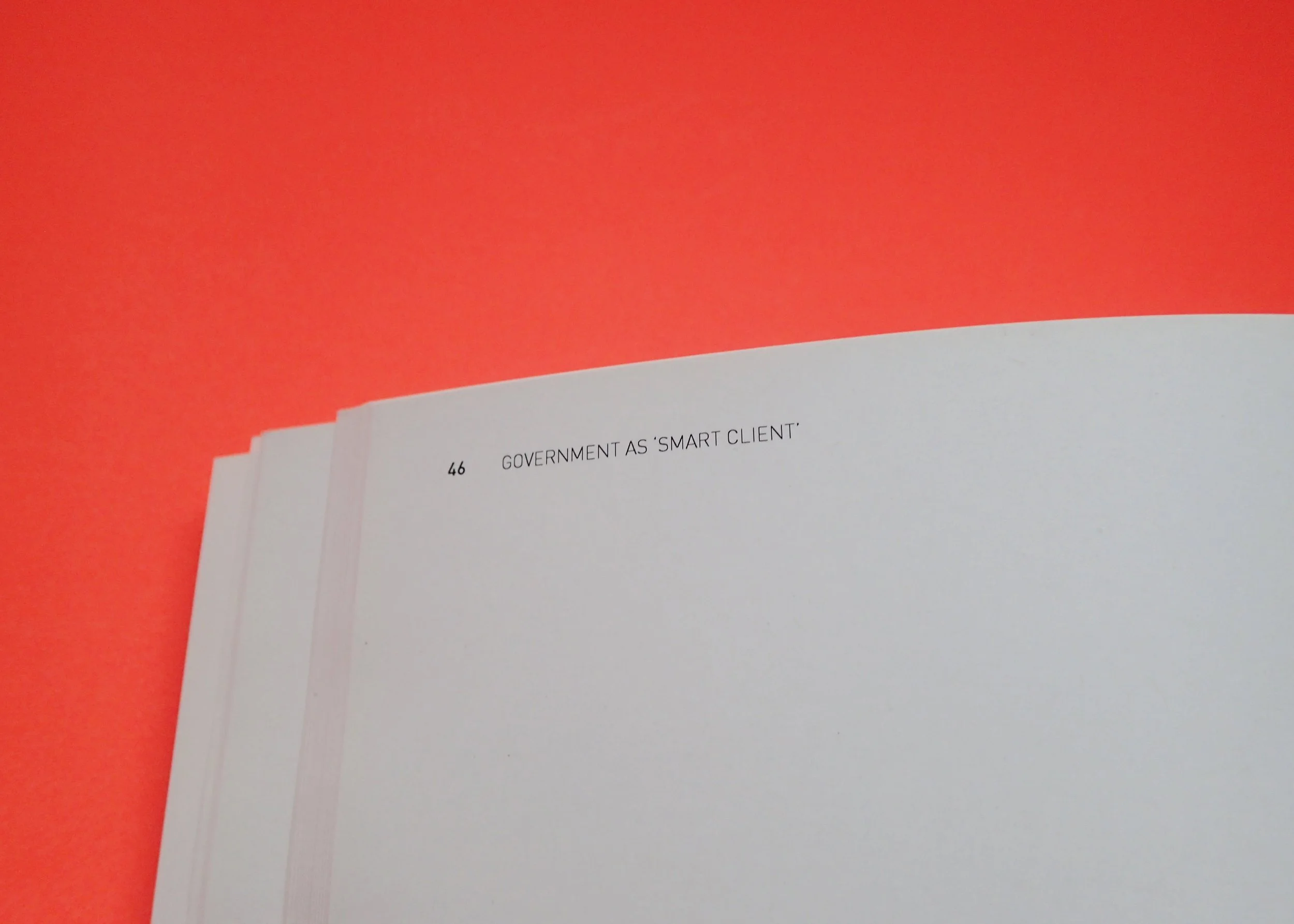  An open book showing its page number and texts that says GOVERNMENT AS ‘SMART CLIENT’ 