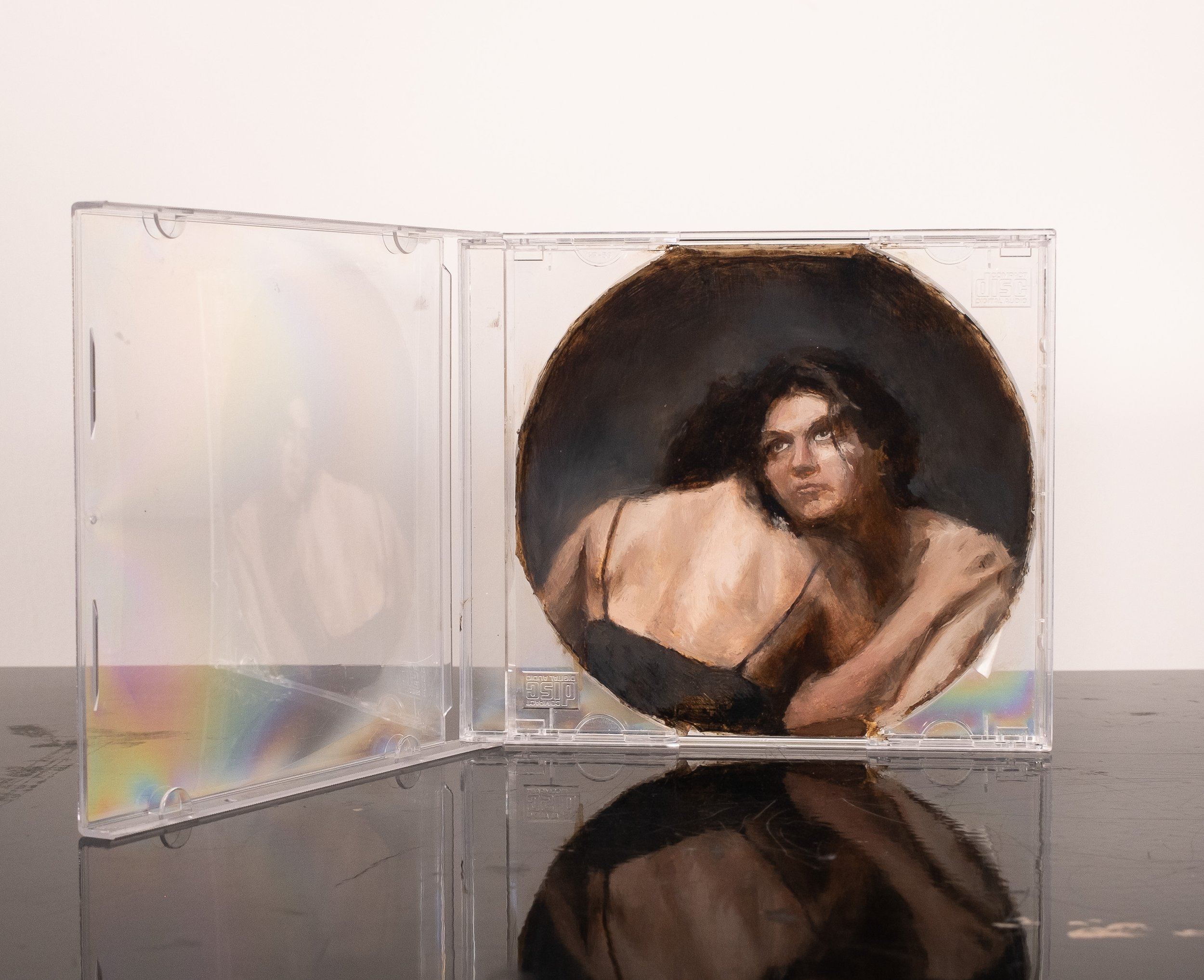  (detail)  2025  Oil on plastic CD case prepared with gesso  5 × 5.75 inches 