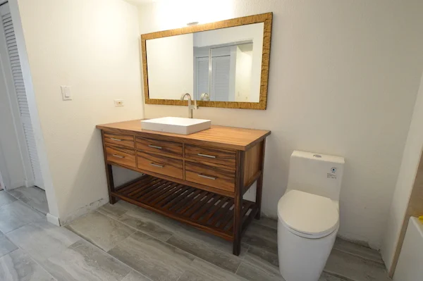 Monkeypod vanity with slatted shelves