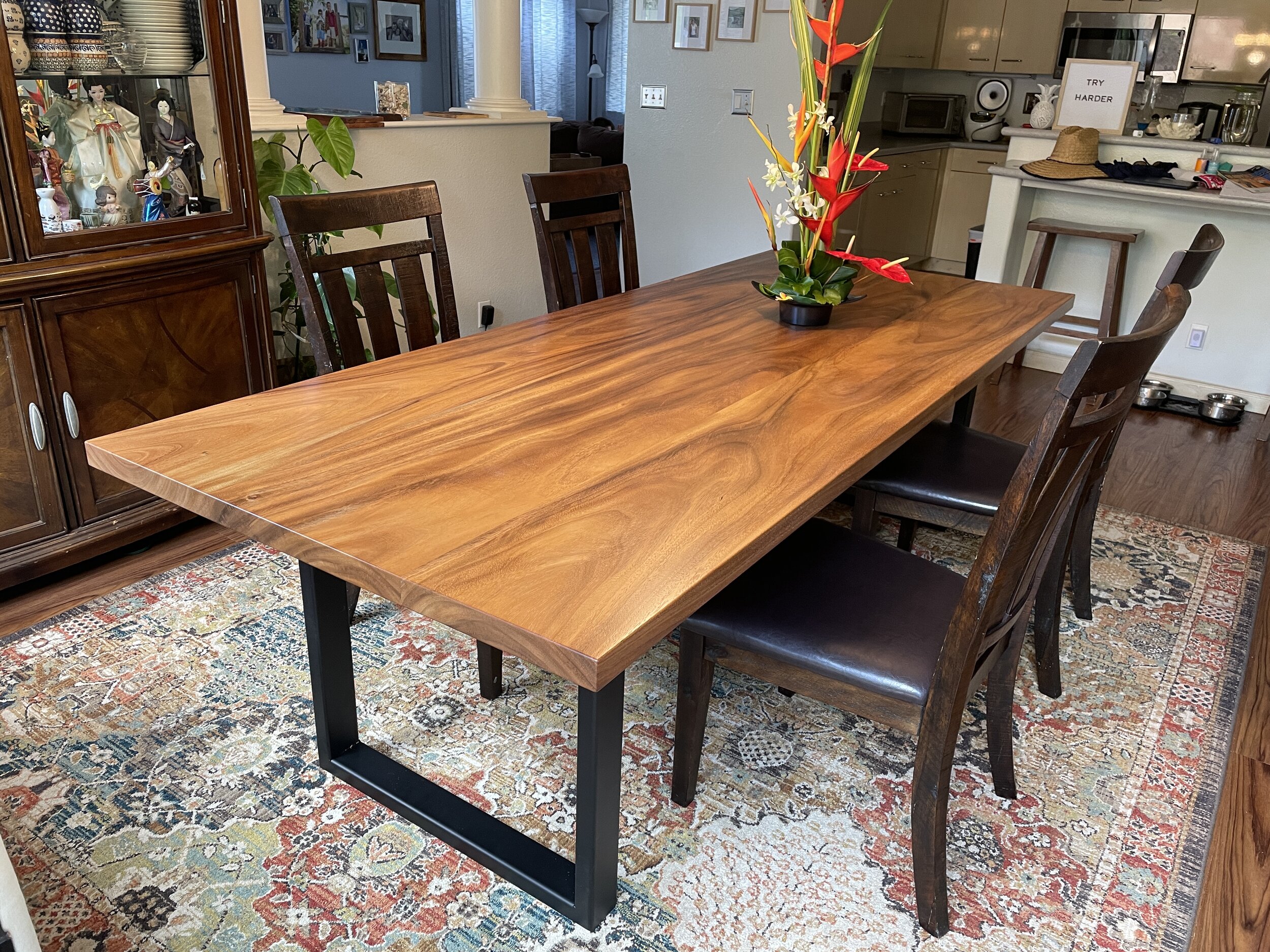 Monkeypod wood table with black steel legs