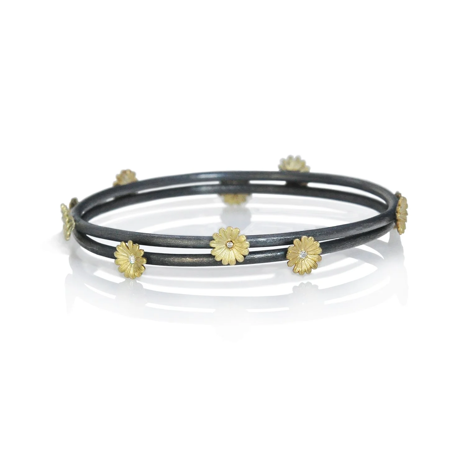 Shasta Daisy Bangles. 14k yellow gold, white diamonds, oxidized silver. Handmade fine art jewelry by Rebecca Myers Design.