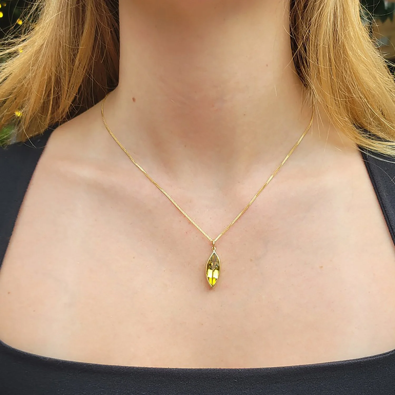 Large Marquis Cut Citrine + Boulder Opal + Hex Aquamarine Charm necklace. On 14k yellow gold chain. Shown on white female model. Handmade fine art jewelry Rebecca Myers Design.
