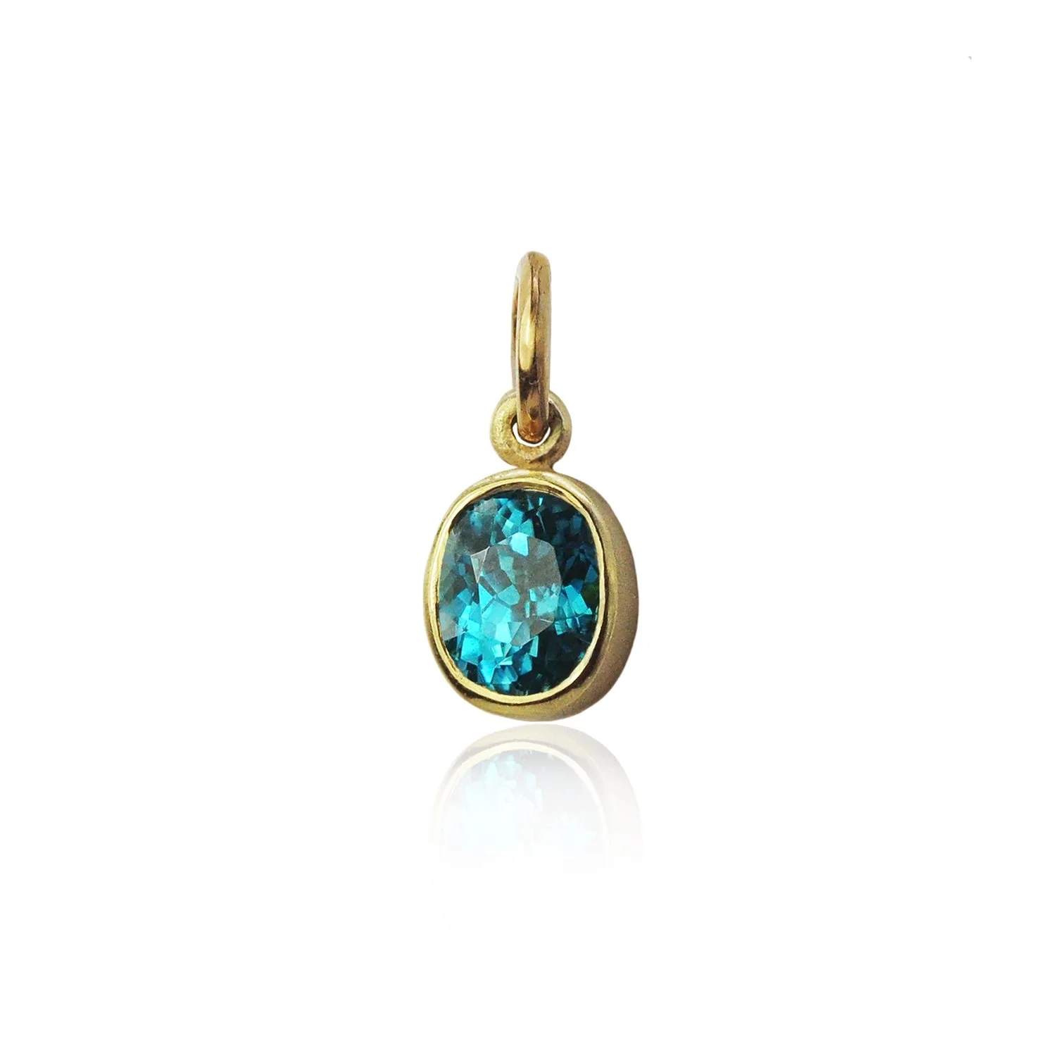 Faceted Blue Zircon Charm. 18k yellow gold, blue zircon. Handmade fine art jewelry by Rebecca Myers Design.