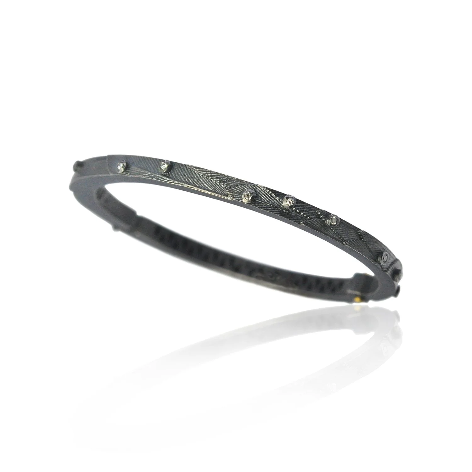 Feather & Tube Set Diamond Hinged Bracelet, Oxidized Silver. 14k yellow gold hinge pin, tube set diamonds, oxidized sterling silver. Handmade fine art jewelry by Rebecca Myers Design.