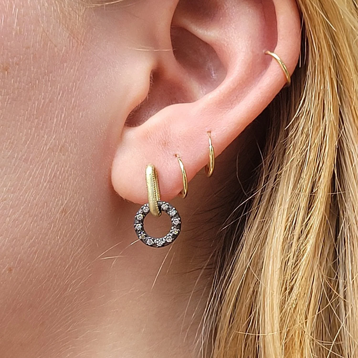 Gold & Oxidized Silver Link Earrings with Pave Set Diamonds. Oxidized silver, 18k yellow gold, pave set white diamonds. Shown on white female model. Handmade fine art jewelry by Rebecca Myers Design.