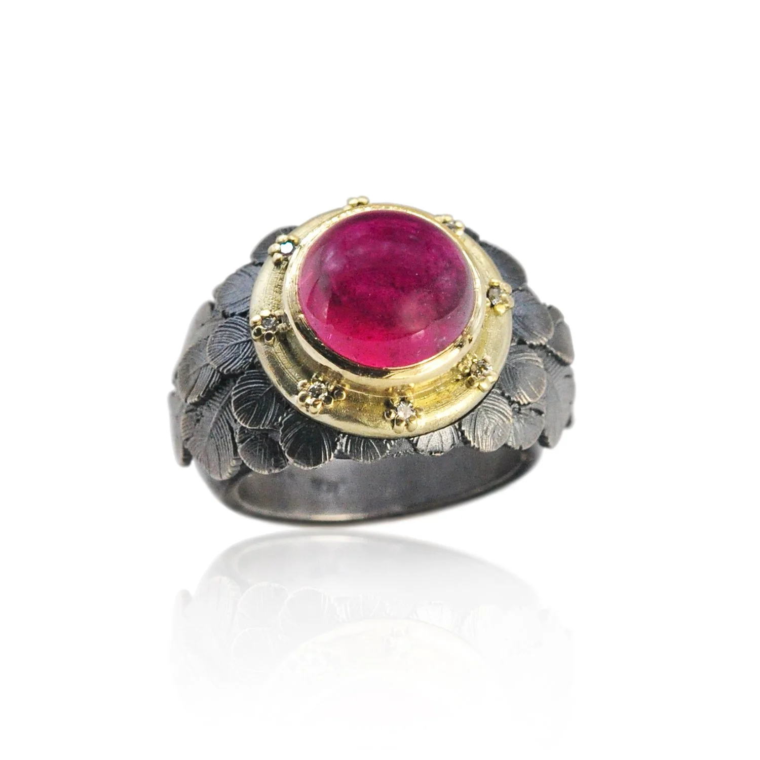 Feather Halo Ring with Pink Tourmaline Cabochon. Pink tourmaline cabochon, 14k yellow gold, oxidized silver, pave set white diamonds. Handmade fine art jewelry by Rebecca Myers Design.