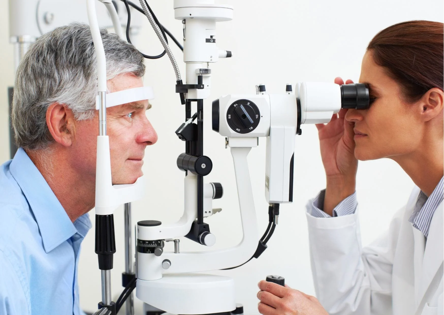 Minds Underground Research Project host carrying our research by examining a man's eye for Oxbridge Medical applicant's study