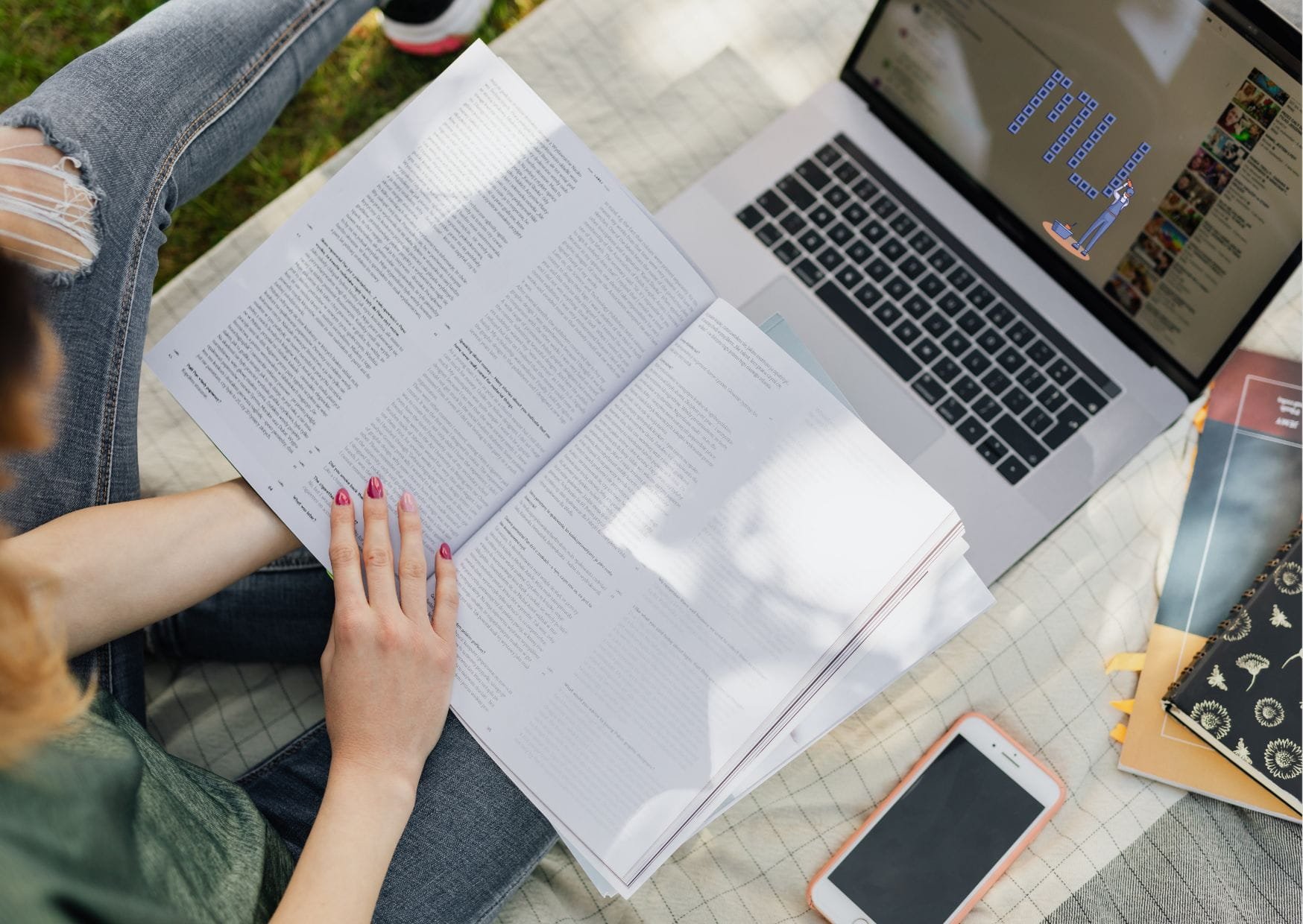 Student reading a textbook with her laptop open, researching her Medicine super-curricular: Minds Underground Essay Competition submission.