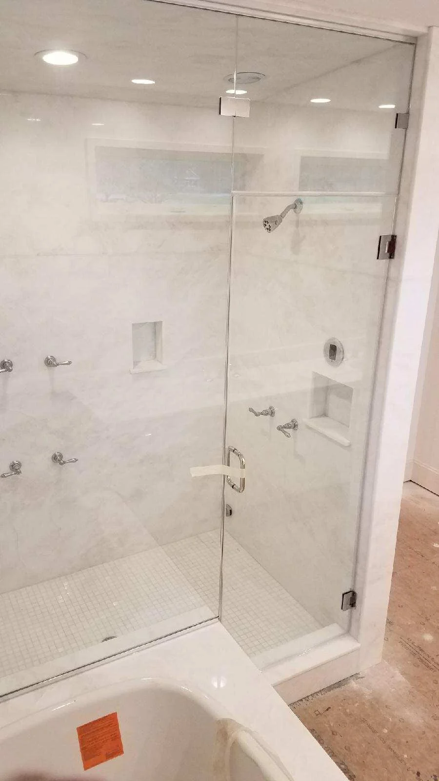 Frameless Door with Panel and Transom Steam Shower.JPG