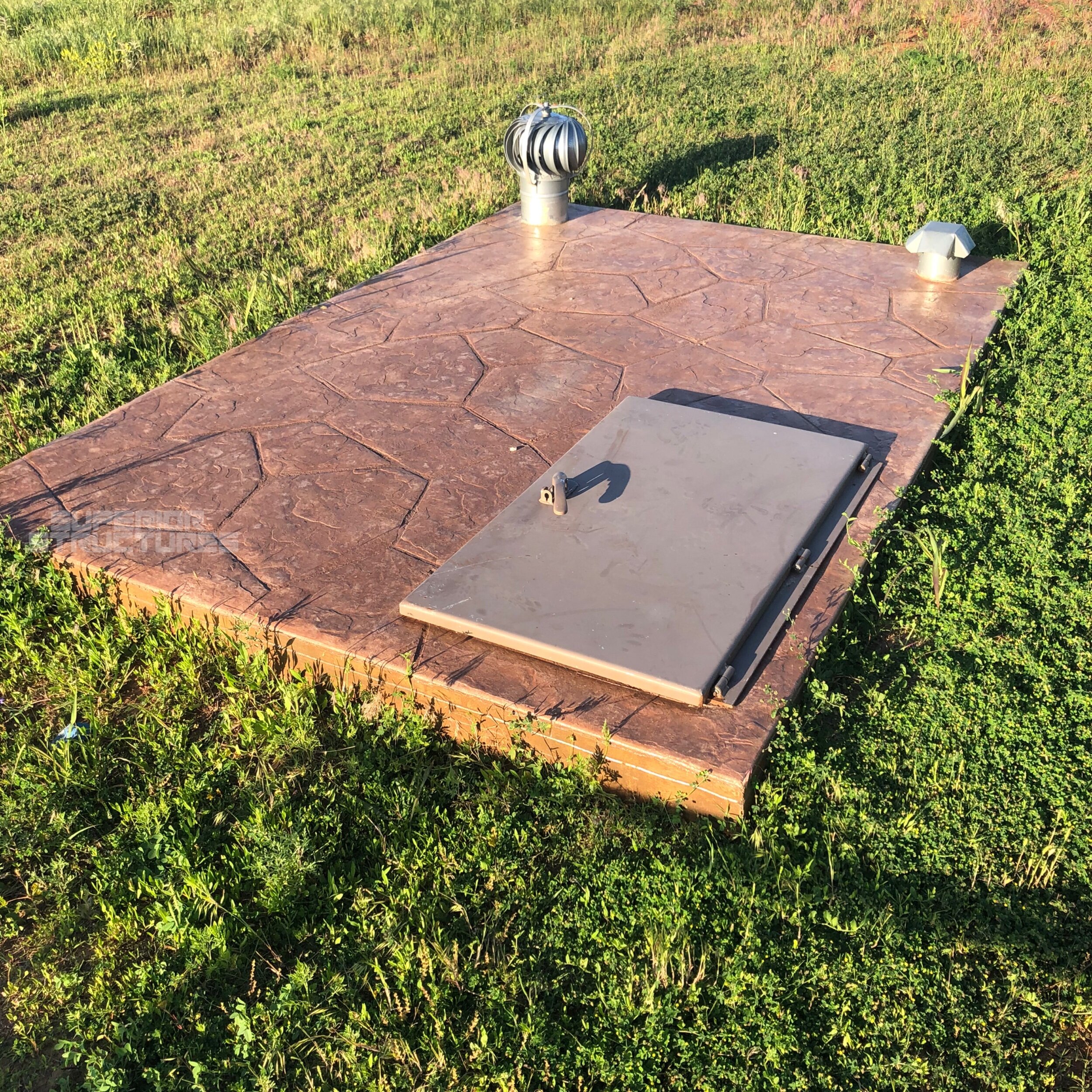 Flat Top Storm Shelter with Stamped Concrete