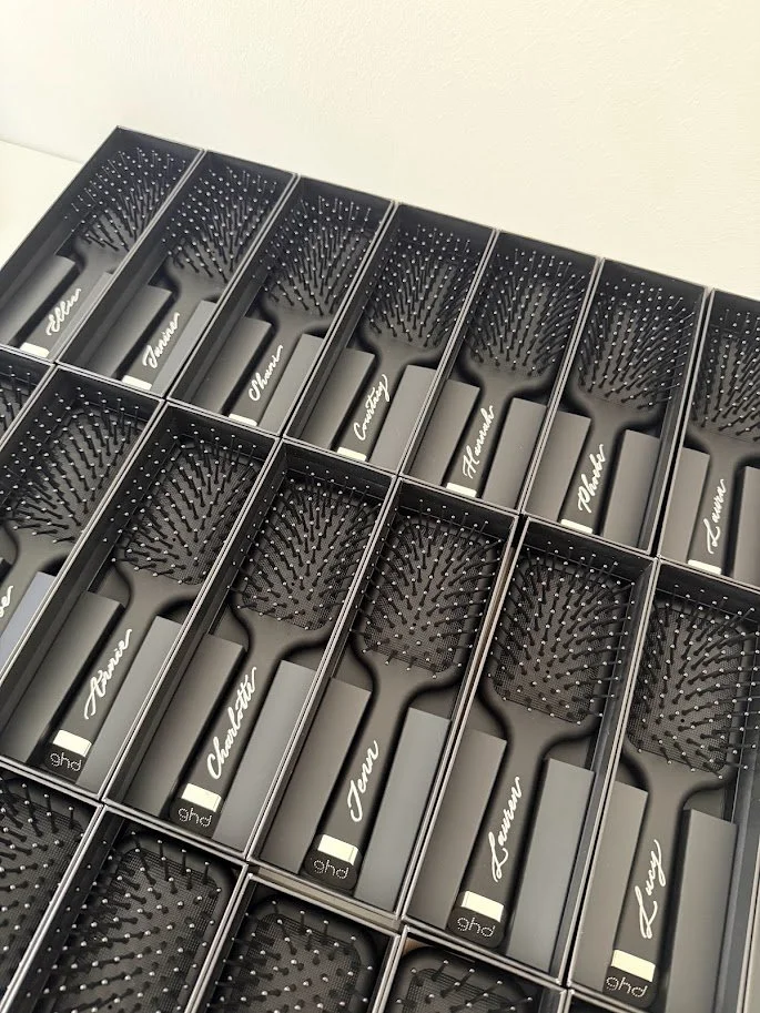 Hand engraved GHD plastic hair brushes for a brand activation. These were used as place settings for a private breakfast