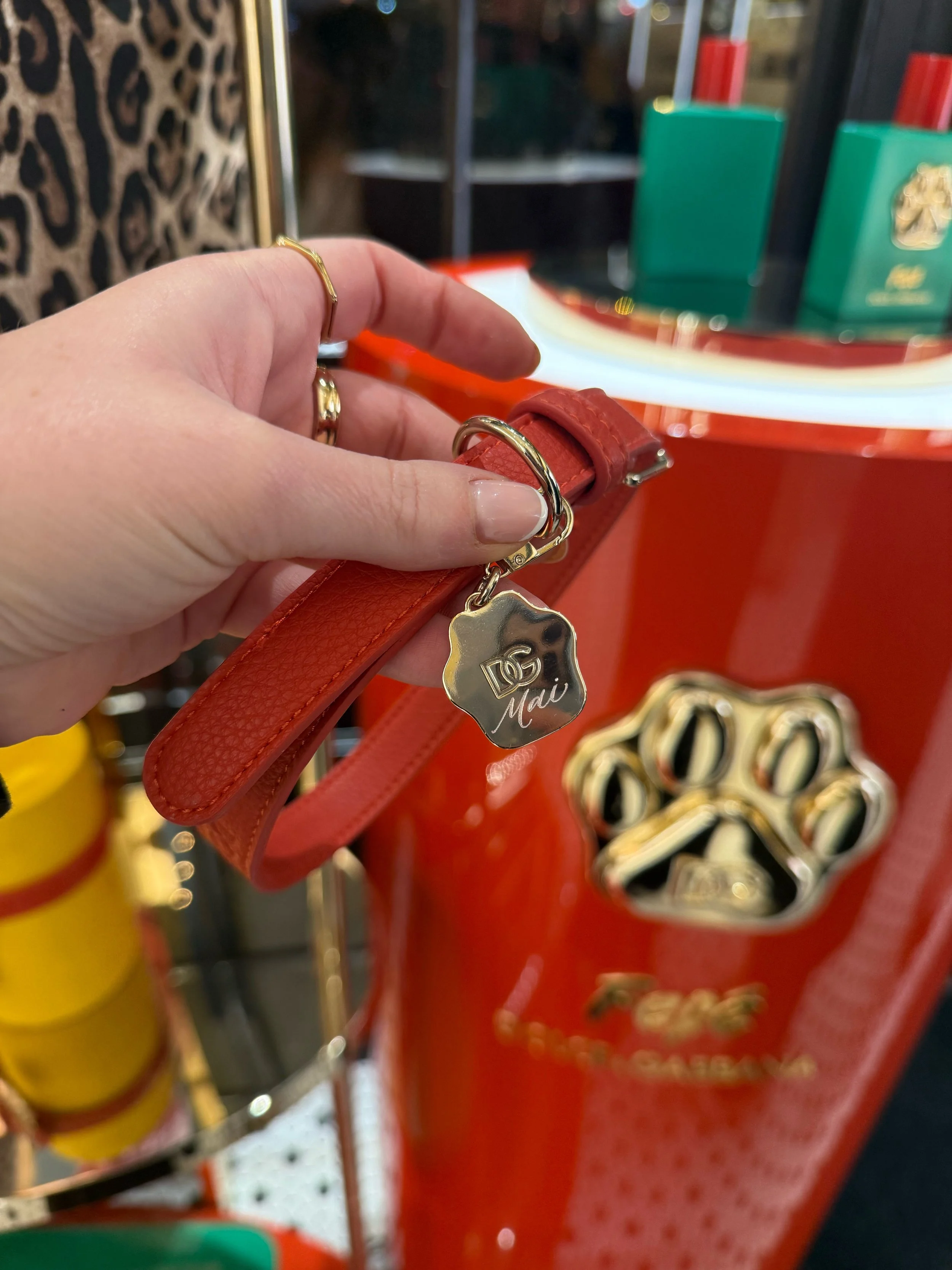 Hand engraved metal dog collars for Dolce and Gabbana London Covent Garden store. Luxury In store live engraving in London