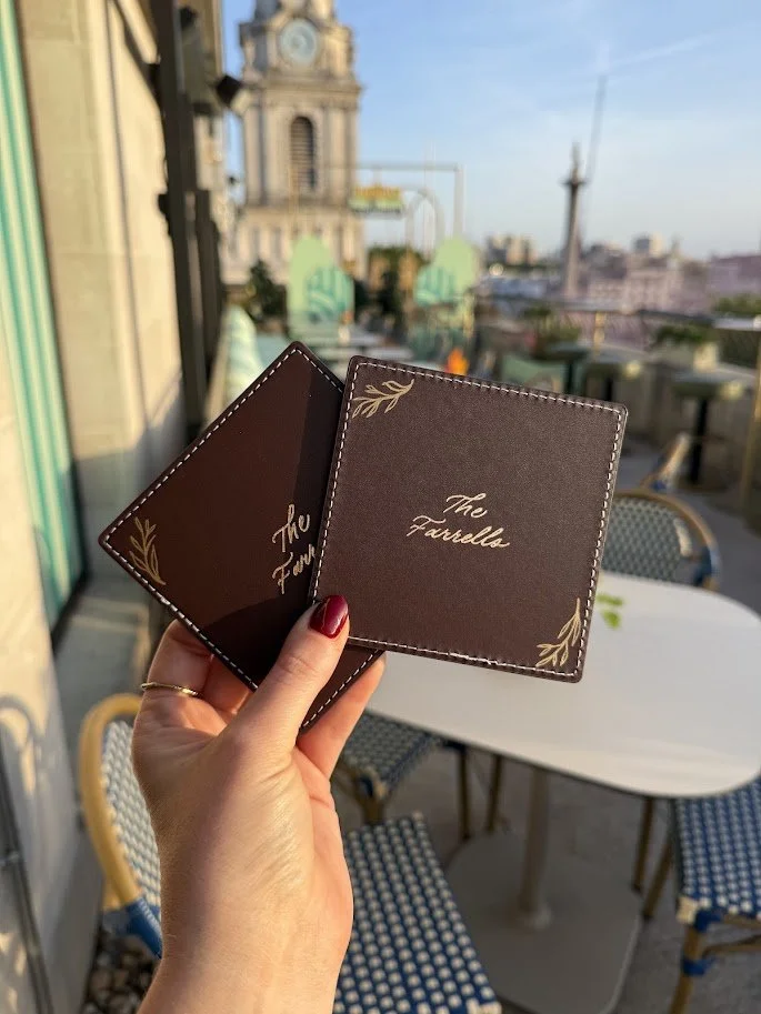 heat foiling leather drinks coasters at a rooftop wedding in London