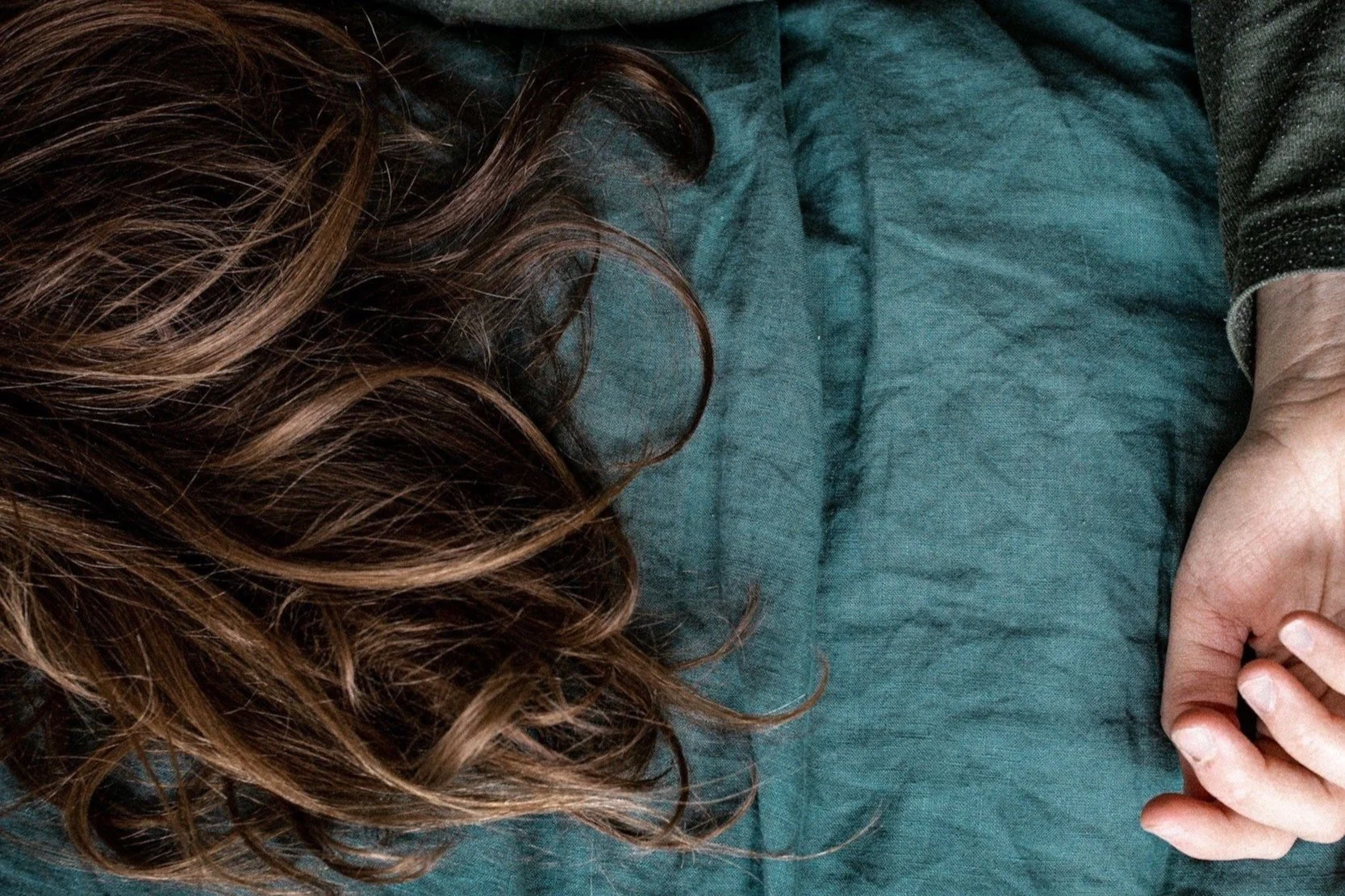 A woman's hair and hand - Helen Moss Therapy