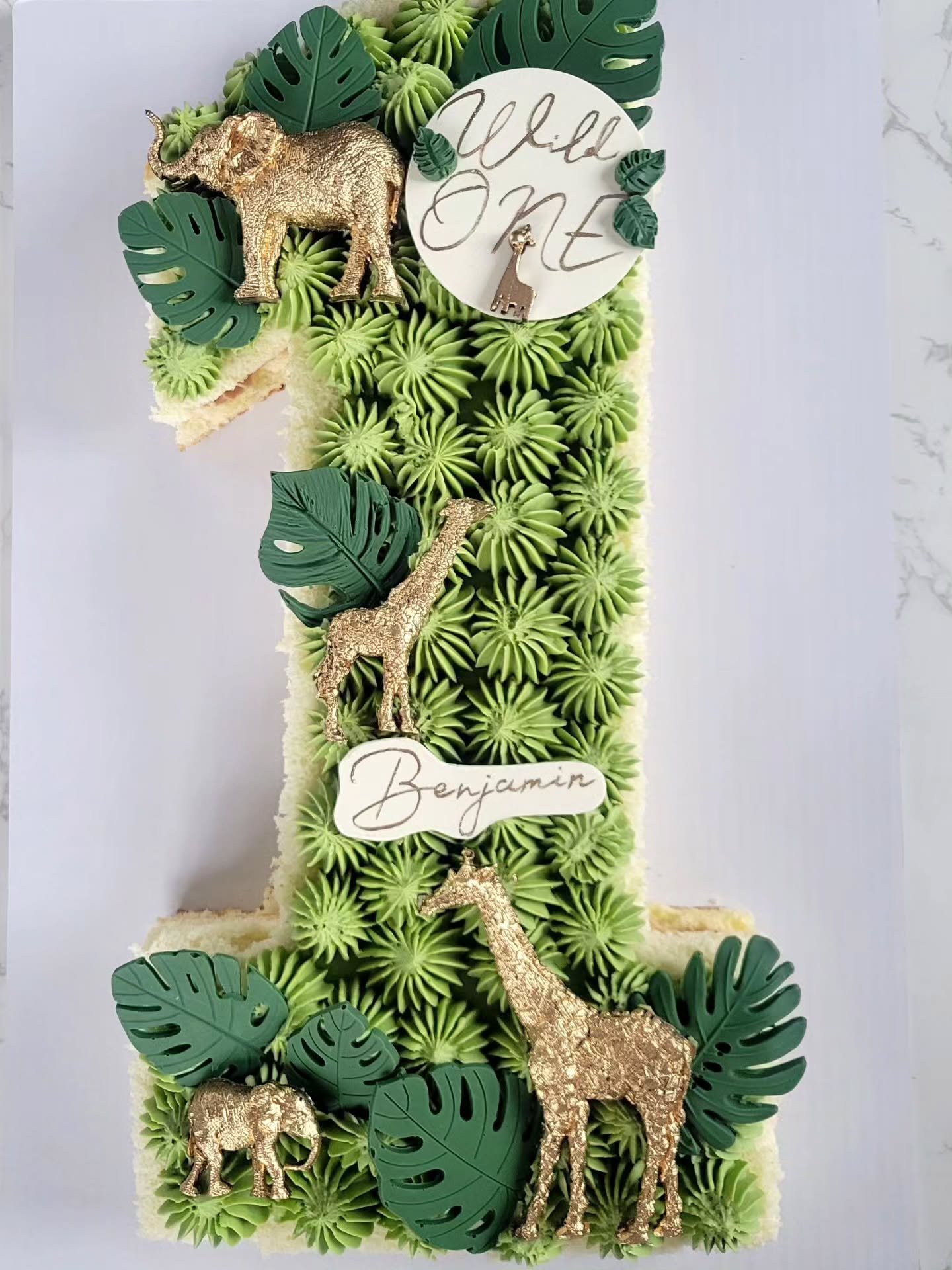 Turning ONE into a wild adventure 🌿✨
A jungle-inspired birthday cake created for a little explorer &mdash; with handcrafted details, safari animals, tropical leaves, and soft buttercream textures in every bite 🦒🐘

At Tasty Slice we love transformi