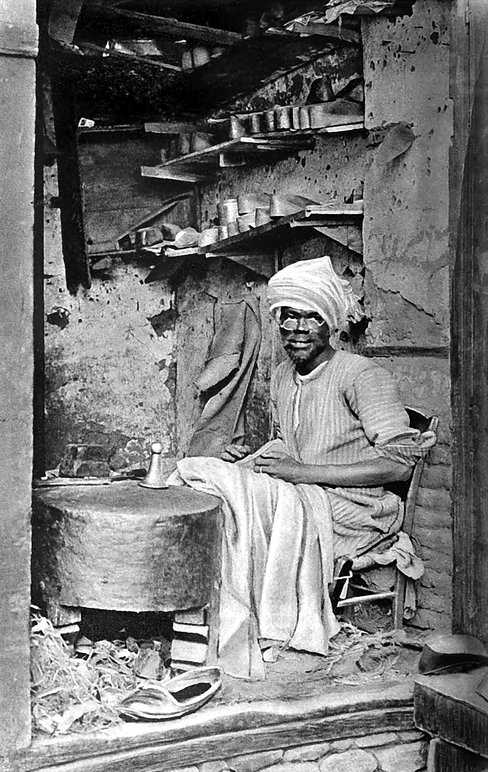 The Cobbler makes red leather slippers worn by the Cairenes