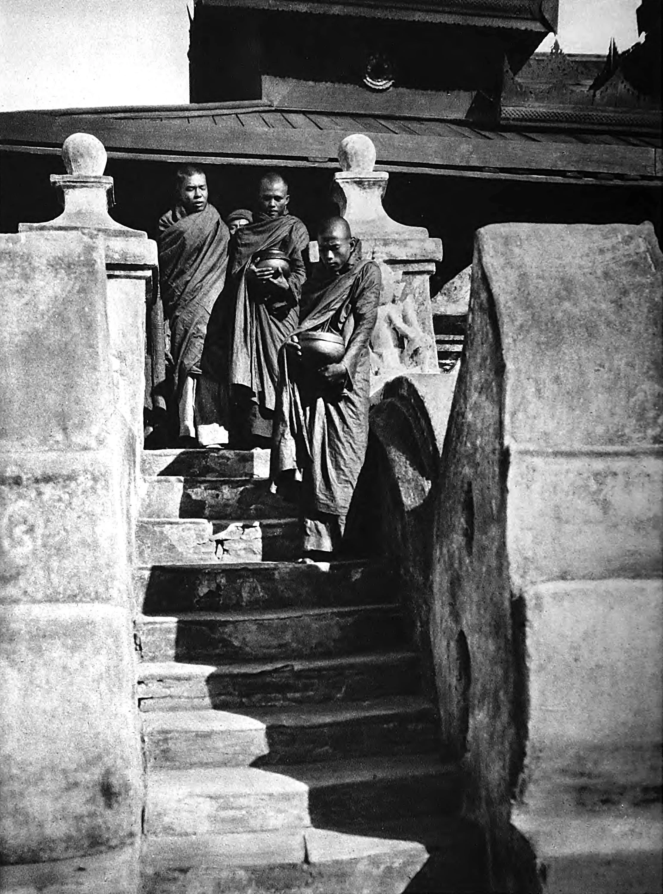 Monks leaving the Monastery at early morning with the begging bowl