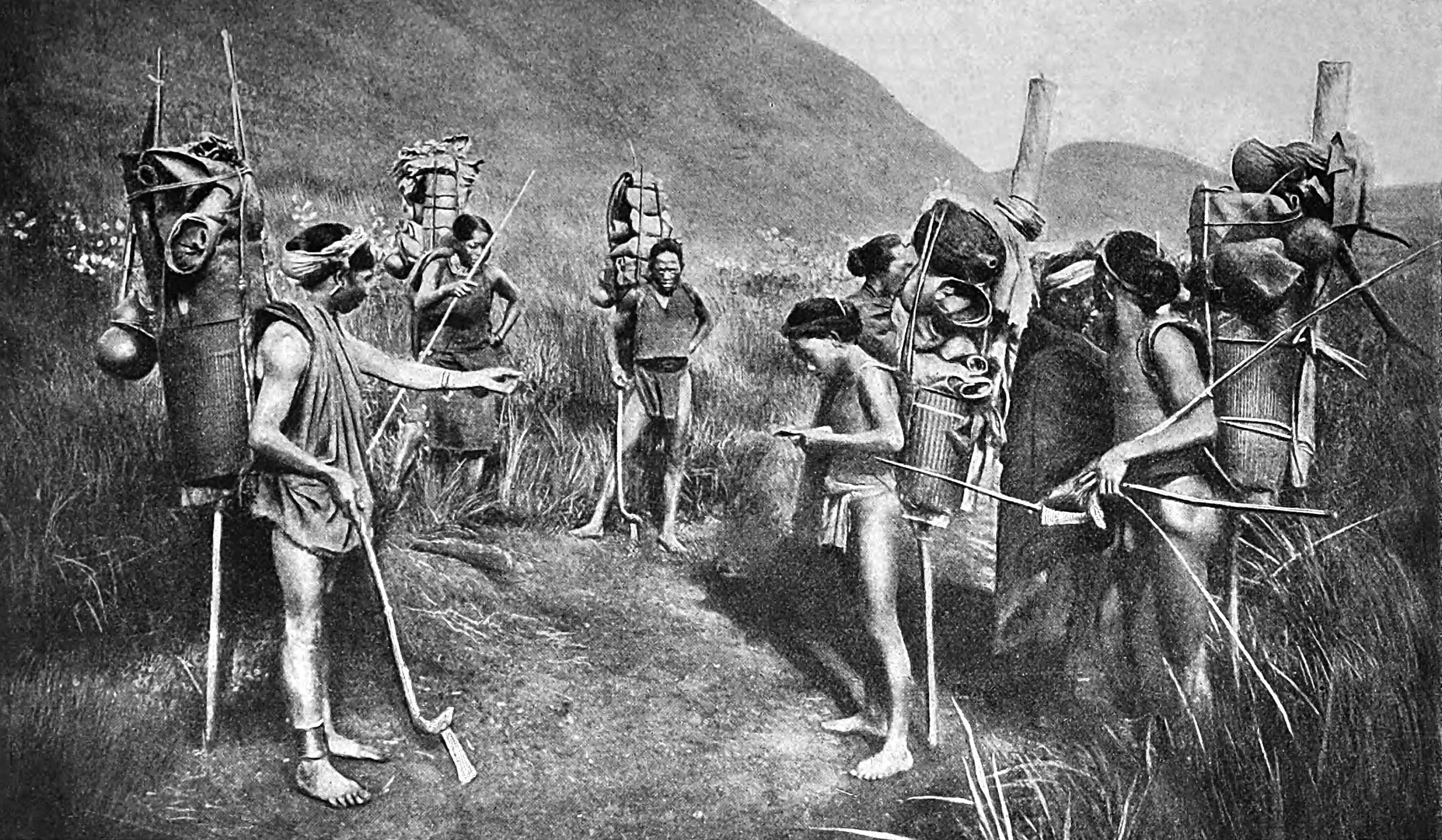 Marching Band of Moi Tribesmen piled with food and kit
