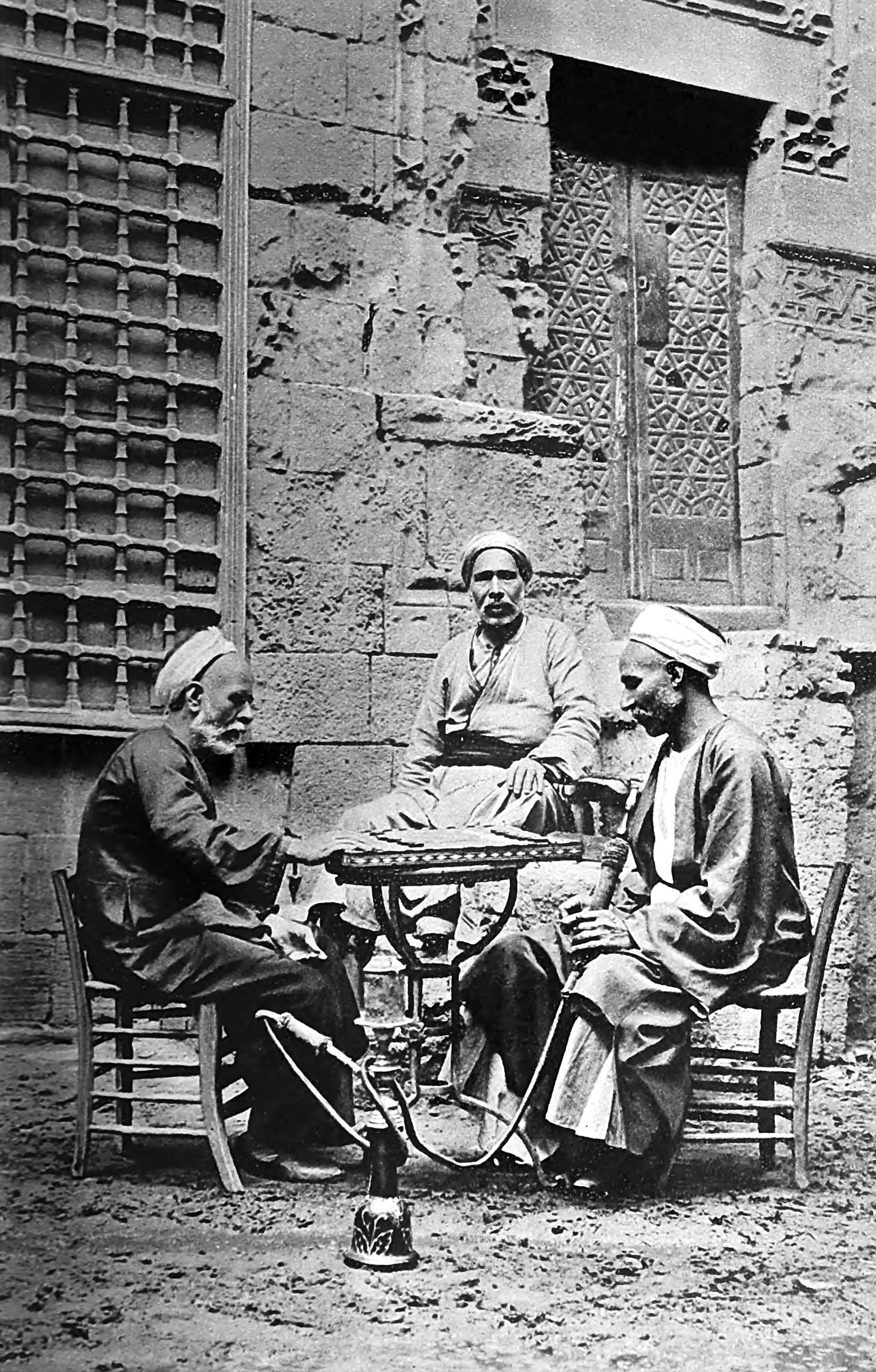 Enjoying a quiet game of draughts in their courtyard