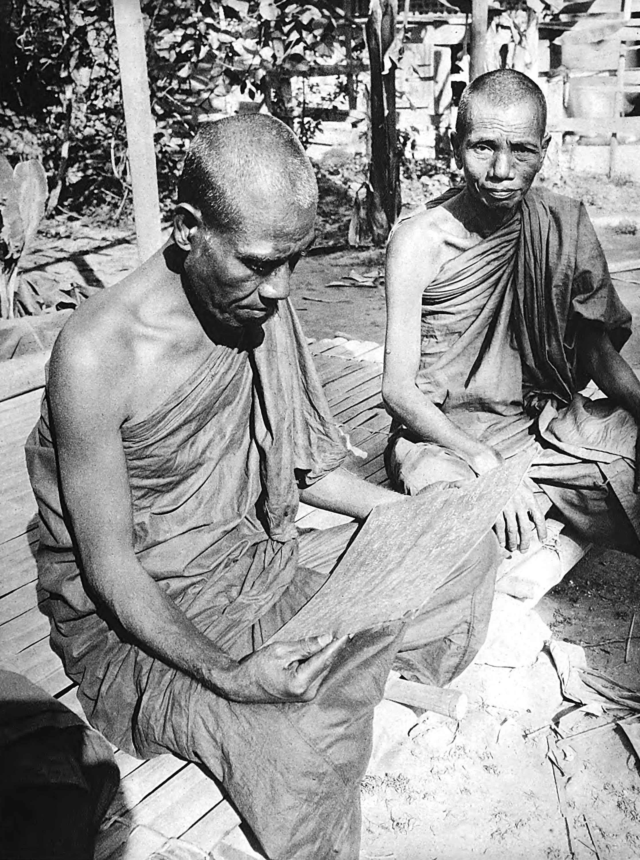 Pungis(Monks) with palm-leaf book