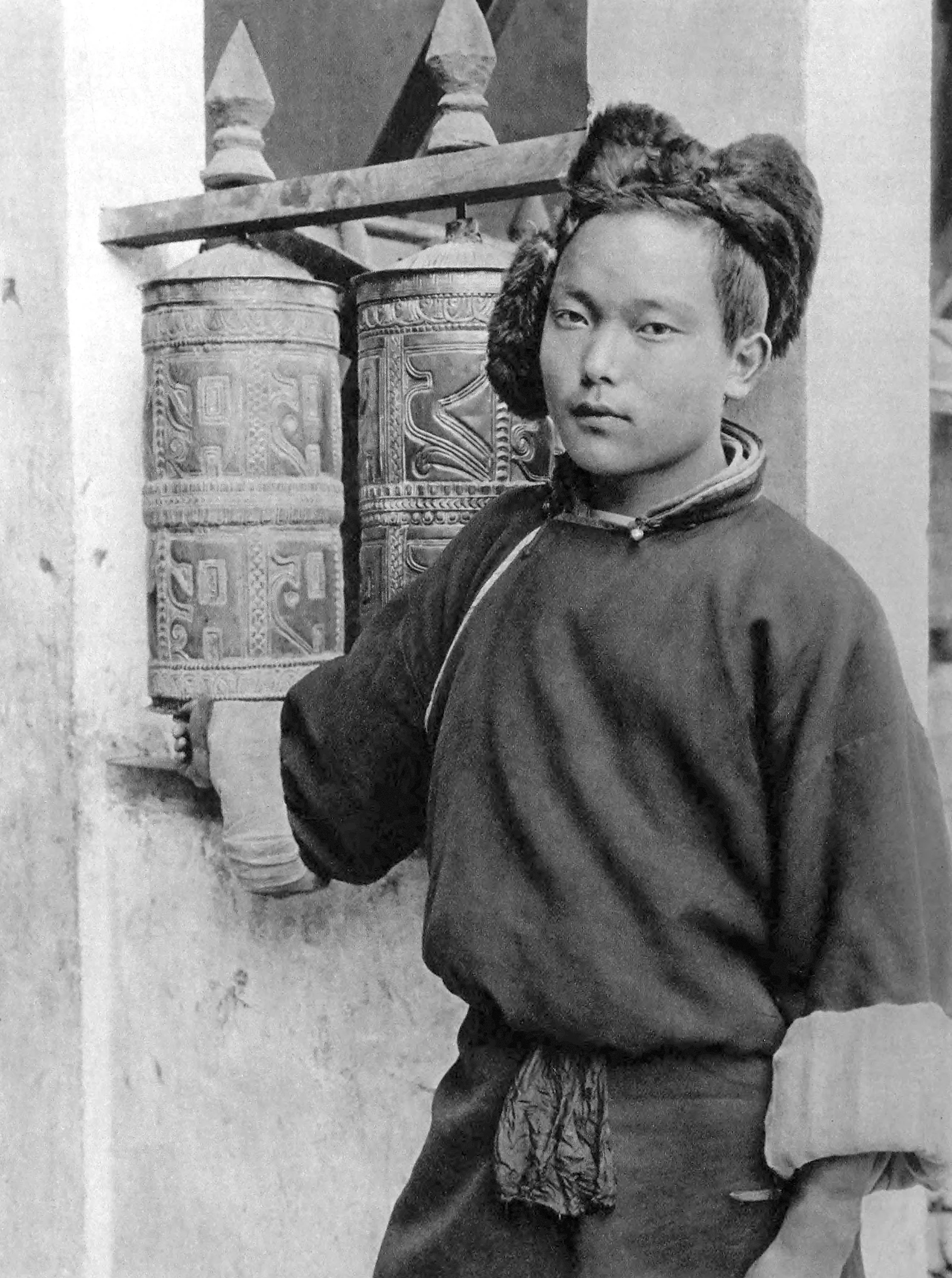Darleeing. Young Tibetan Monk with Prayer-Mill