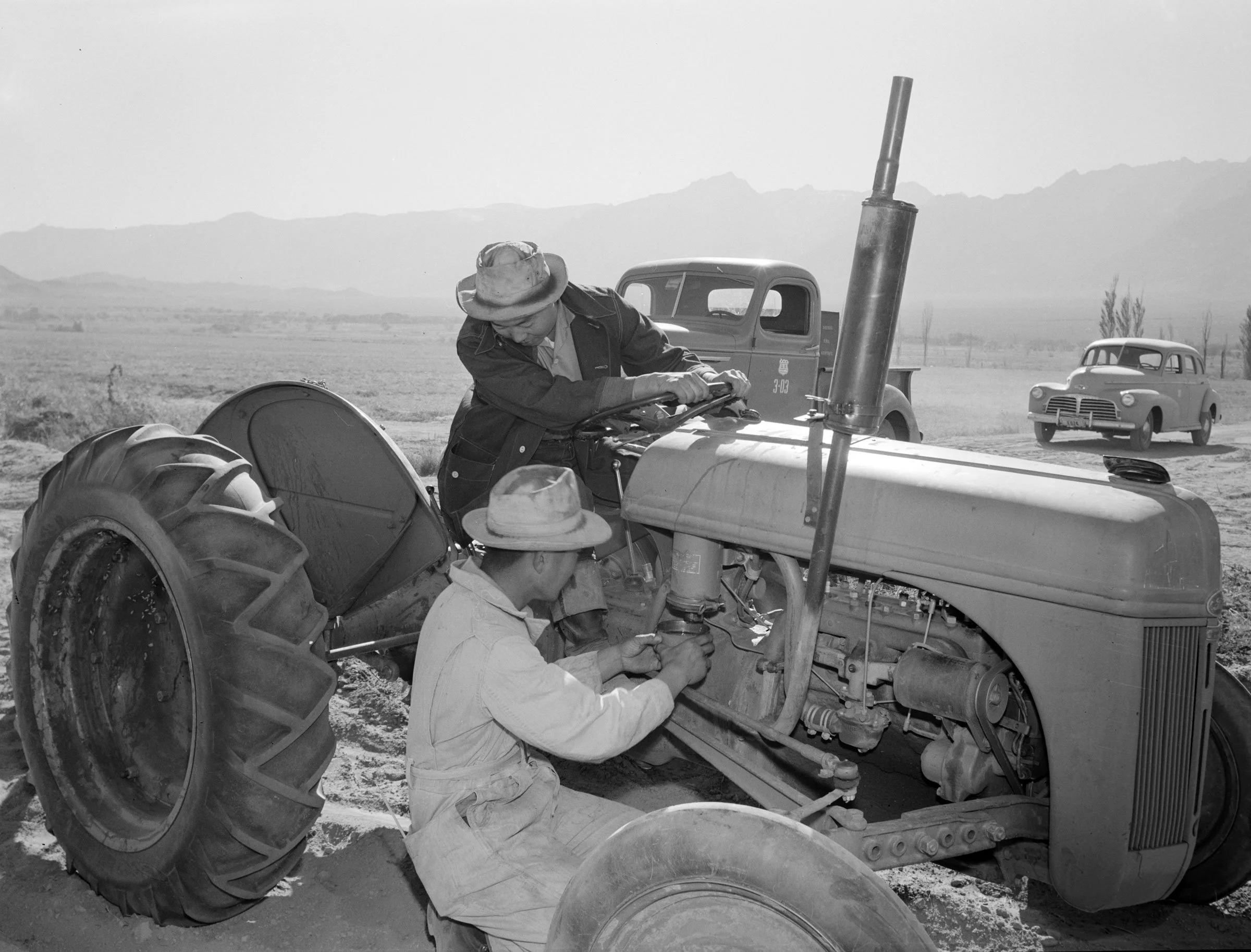Tractor repair Driver Benji Iguchi, Mechanic Henry Hanawa, Manzanar Relocation Center, California