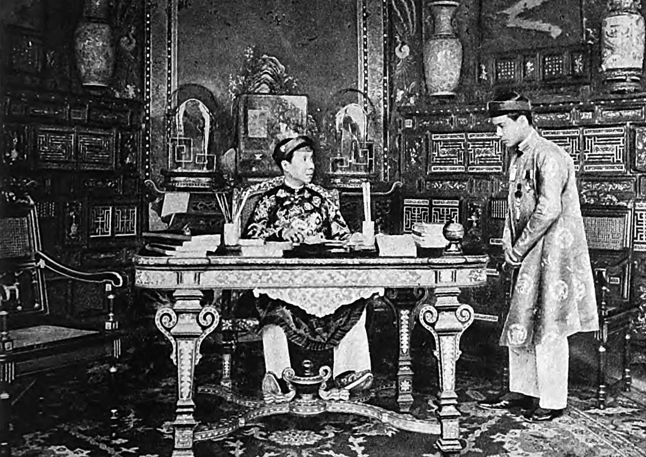 The Emperor transacts business with his secretaries