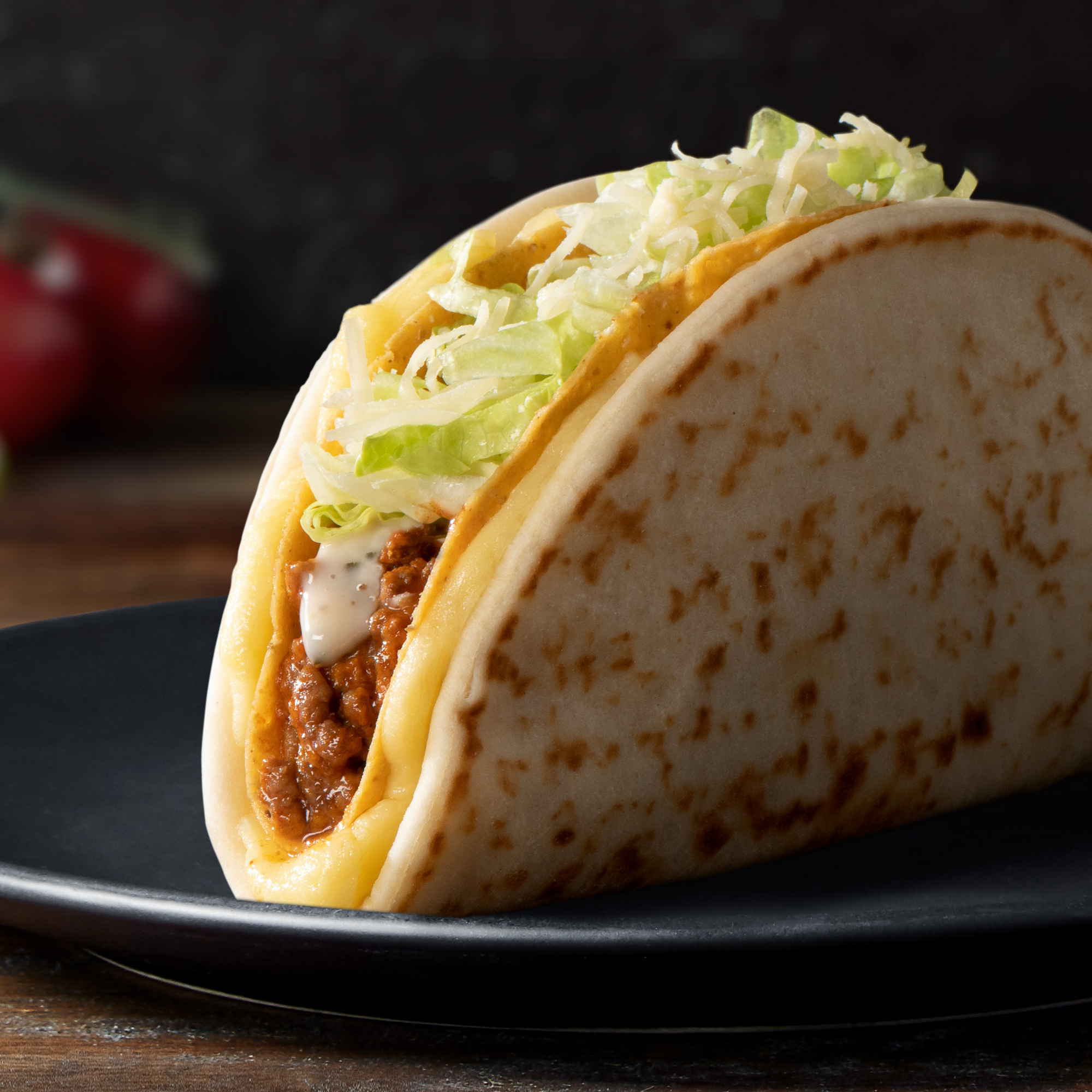 Cheesy Gordita Crunch™  They don't call it the O.M.Cheesy.G for nothing! Guaranteed to change the way you think about tacos as you know them. It is chewy, crunchy and cheesy, all in one. It is made with a crunchy taco shell, filled with your choice of protein, creamy ranch sauce, shredded iceberg lettuce, topped with cheddar cheese, all nicely tucked into a warm flatbread with melted cheese.