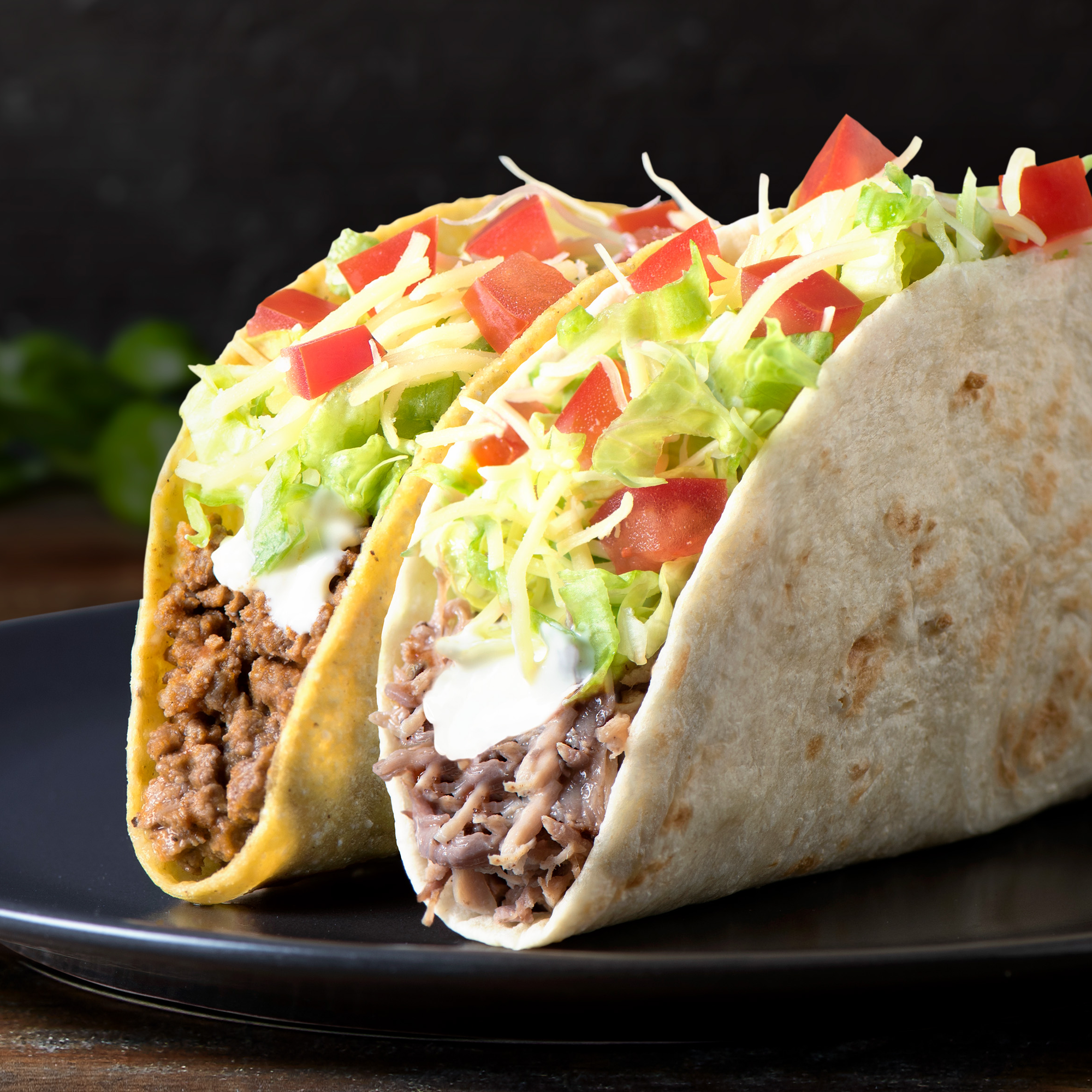 Double Tacos Supreme  Sometimes soft, sometimes crunchy, but always delicious. Choose your taco shell (soft or crunchy) filled with your choice of protein, sour cream, diced tomato, shredded iceberg lettuce and cheese.