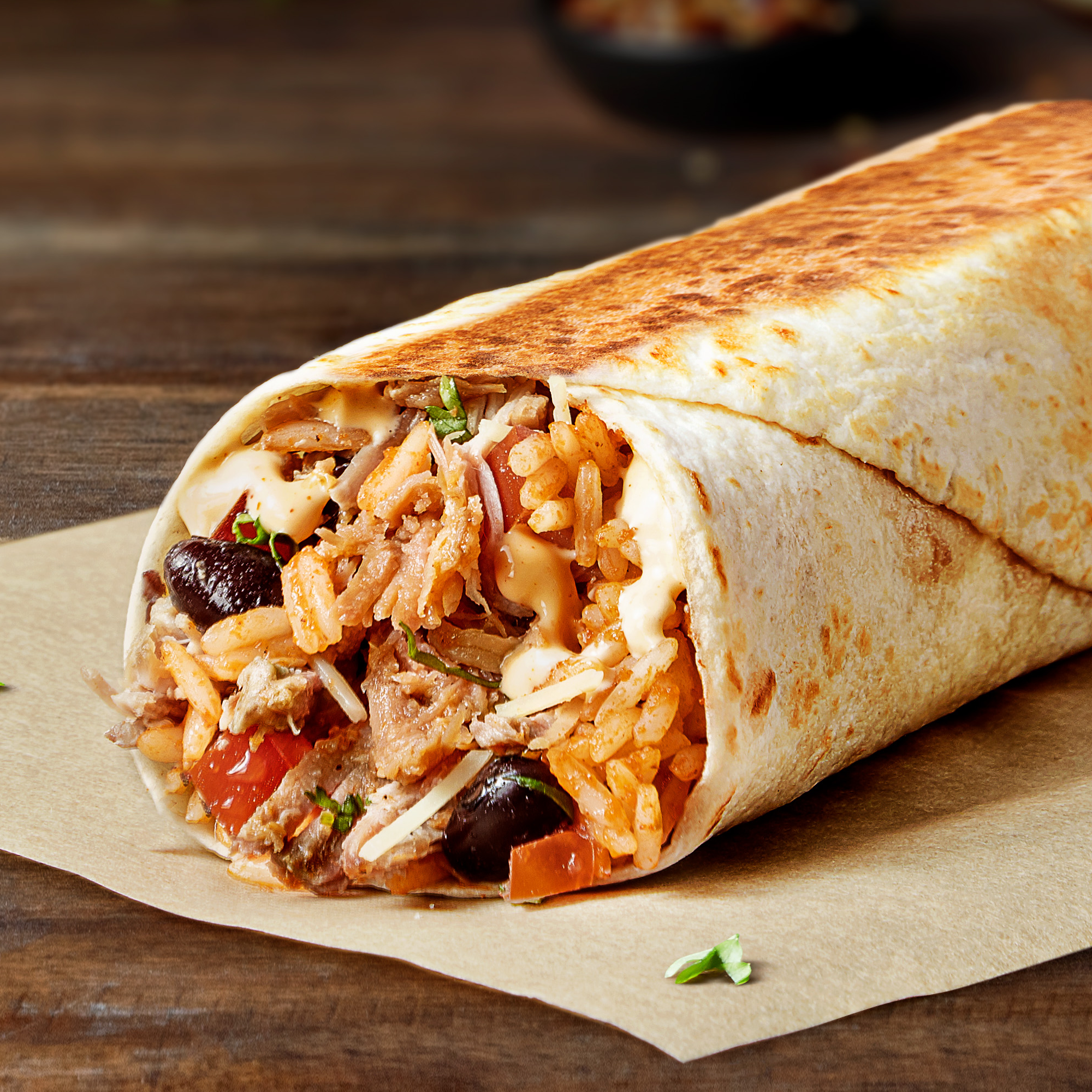Grilled Stuft Burrito  It is the perfect full-filling option. It is a soft tortilla packed with double portion of your choice of protein, Mexican rice, seasoned black beans, creamy chipotle sauce, fiesta salsa, sour cream and cheese. Grilled to perfection.