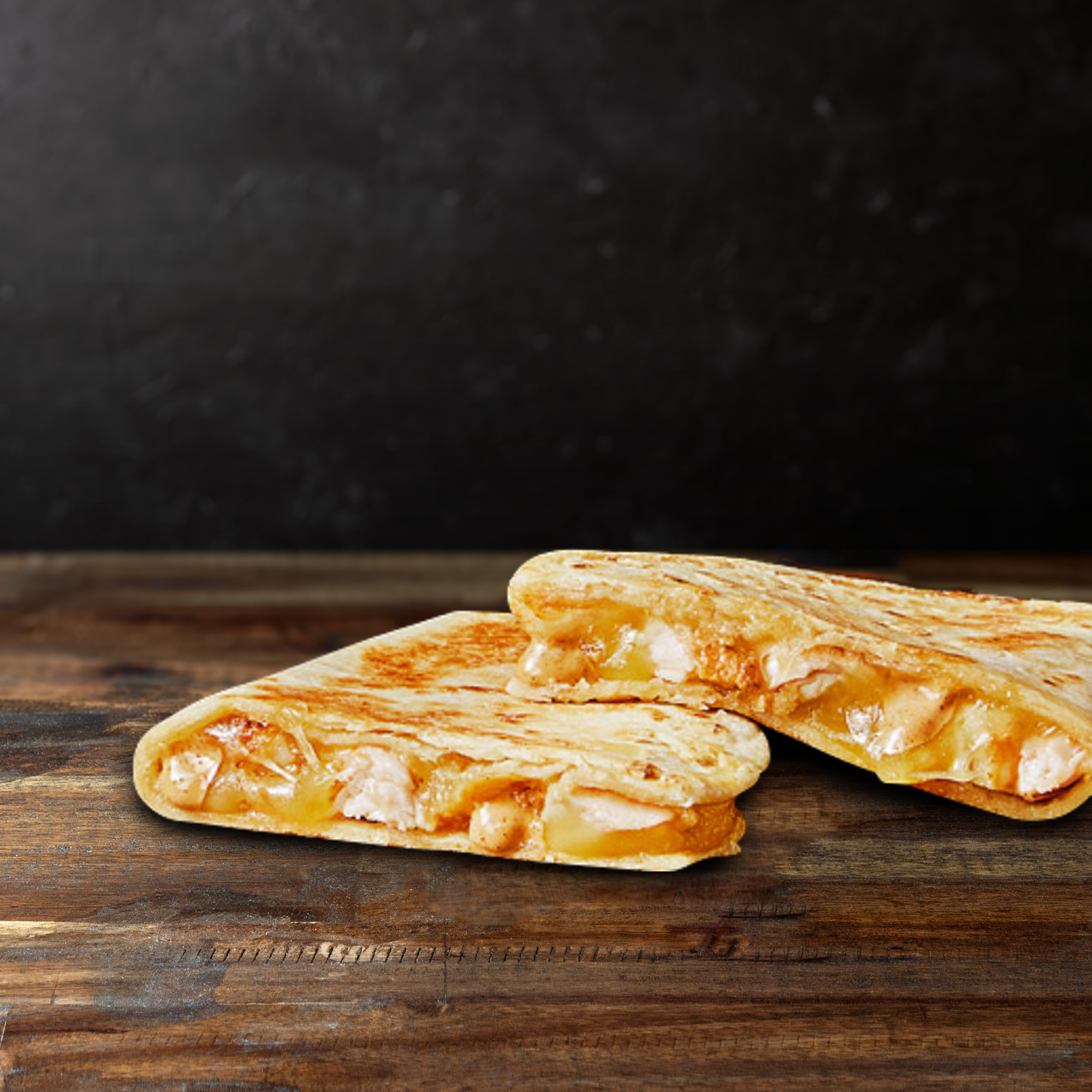 MINI CHICKEN QUESADILLA  Grilled soft tortilla filled with melted cheese, creamy jalapeno sauce and chicken. Good things come in small packages.