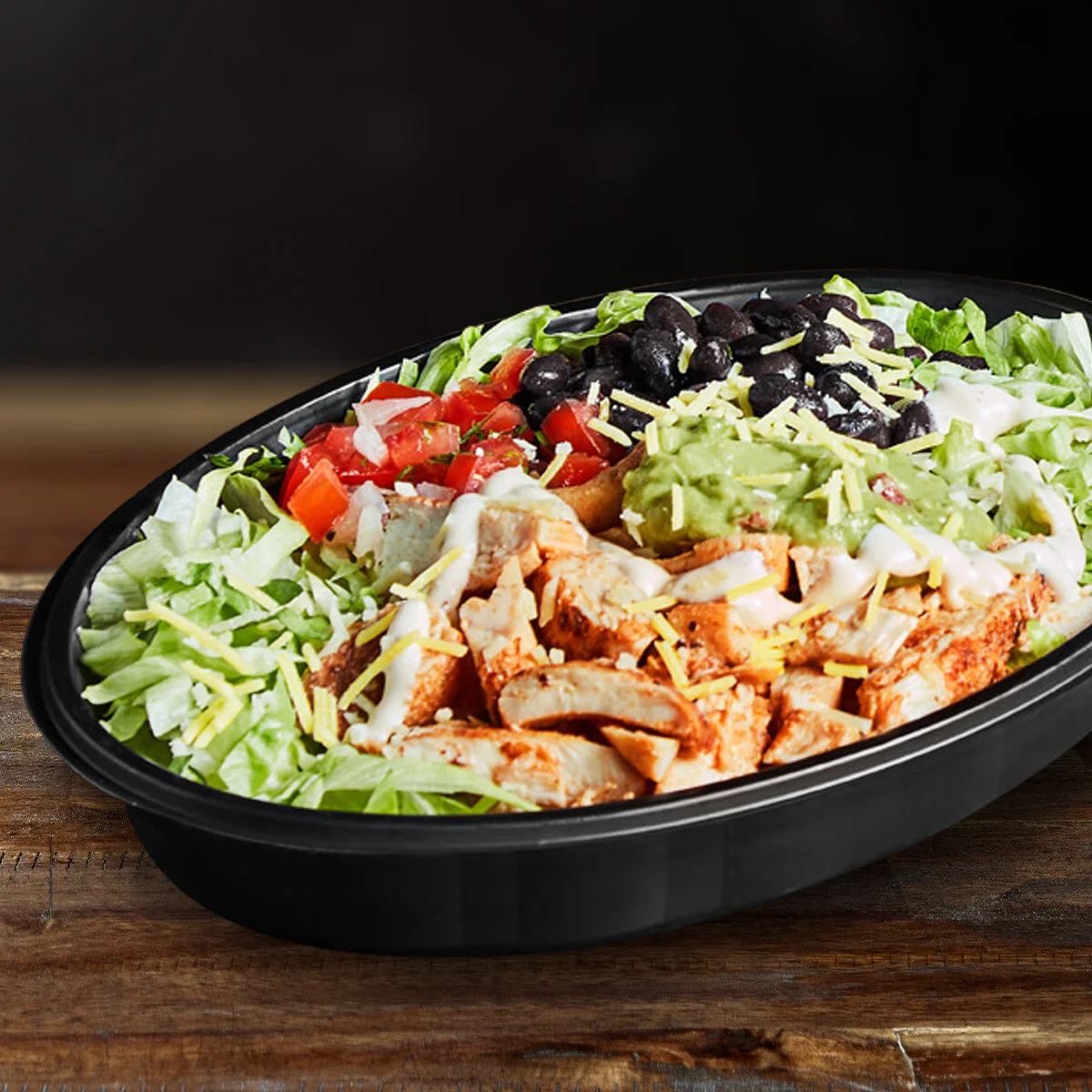 cali bowl  Fancy something lighter? Skip the wrap and enjoy this bowl filled with fiesta salsa, guacamole, seasoned black beans, sour cream, creamy ranch sauce and shredded cheese all on a bed of lettuce.