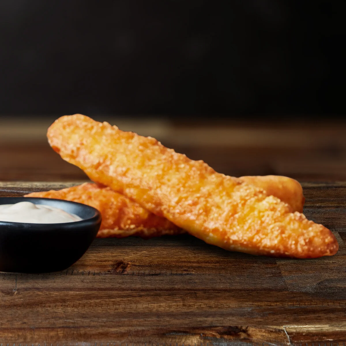 2X CRISPY CHICKEN STRIPS WITH DIP  Who doesn’t like to bite into a golden-brown crispy chicken tender? It goes well with any dip of your choice.