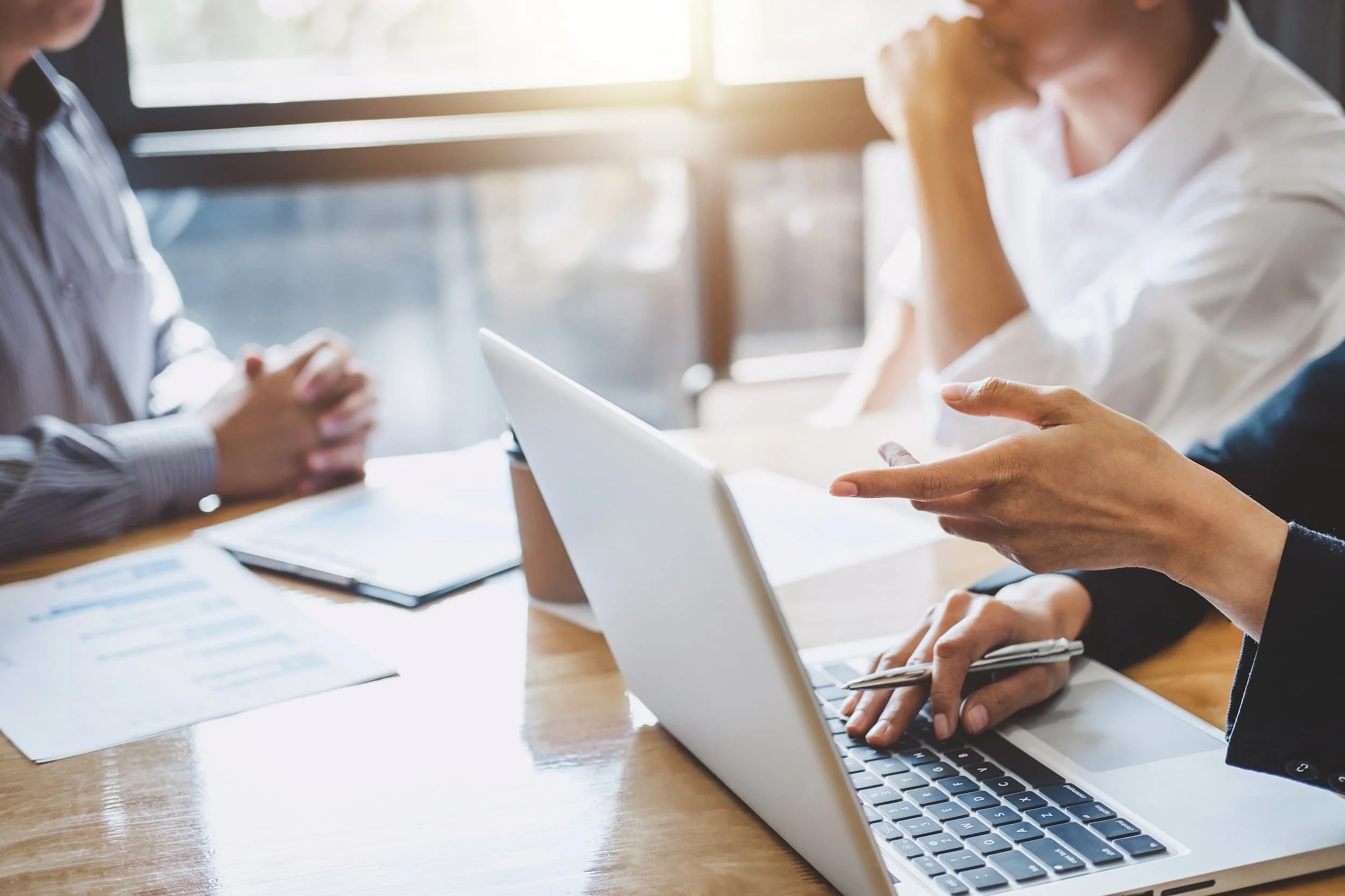 Mastering AI search professionals collaborating on tailored content strategy for diverse platforms.