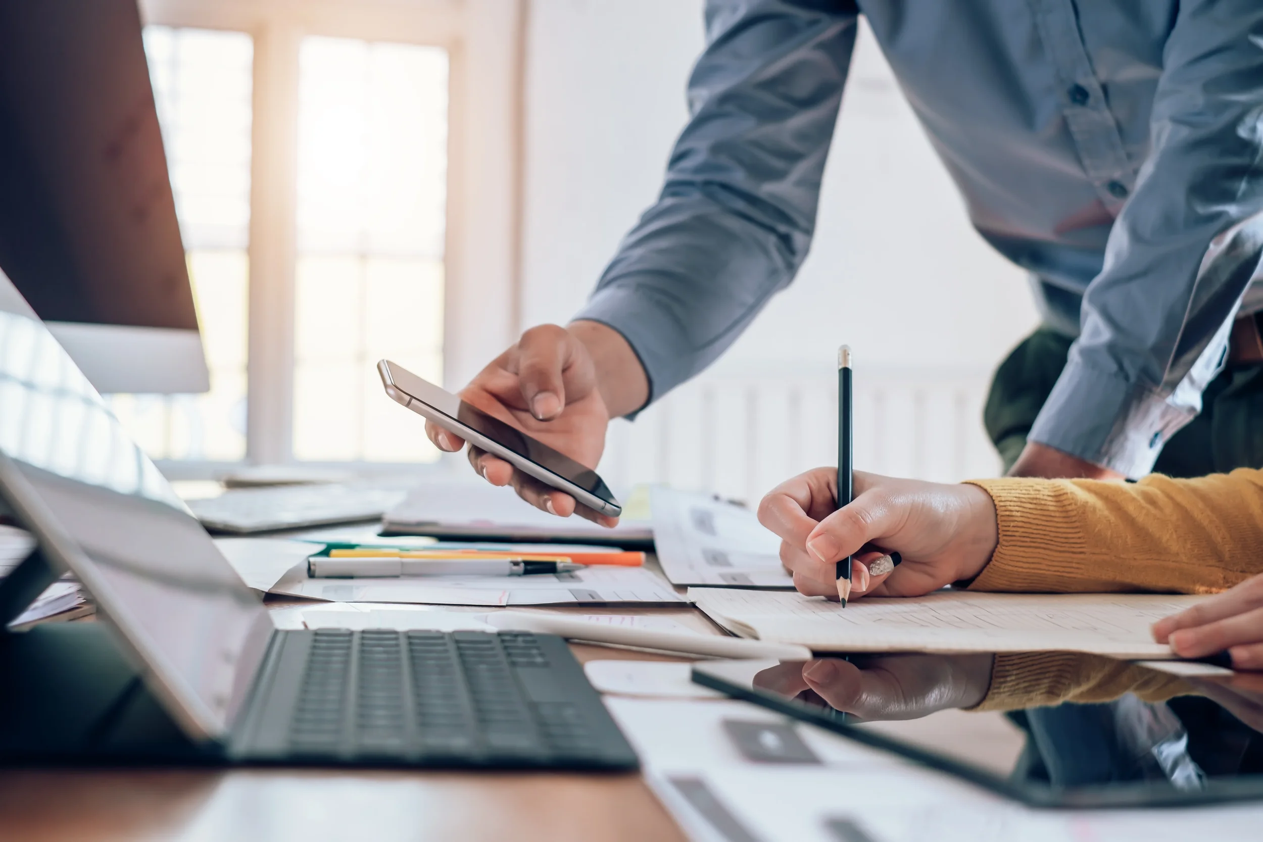 Website design and CMS services represented by businessman evaluating wireframe strategy