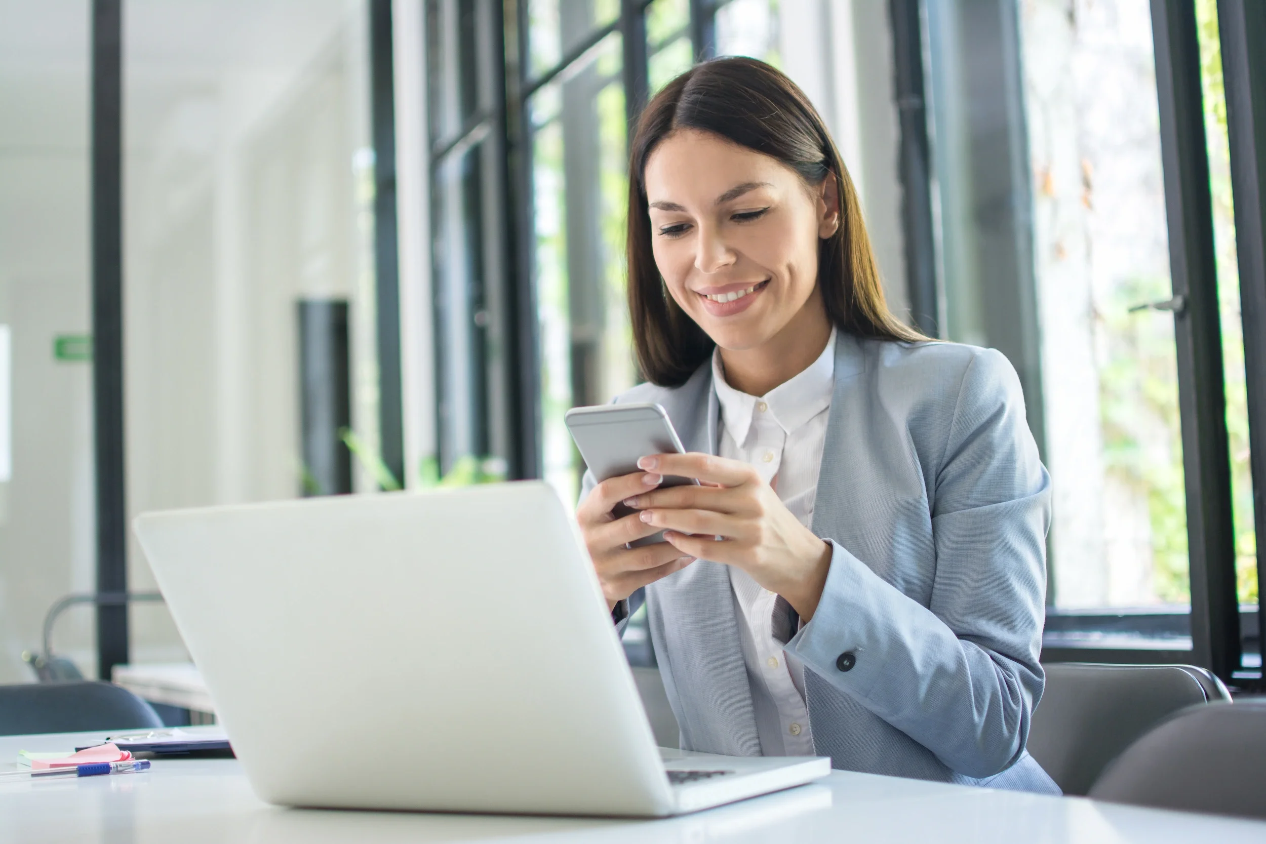 B2B marketing consultant working on a laptop, providing integrated or tactical B2B marketing services for growing firms.