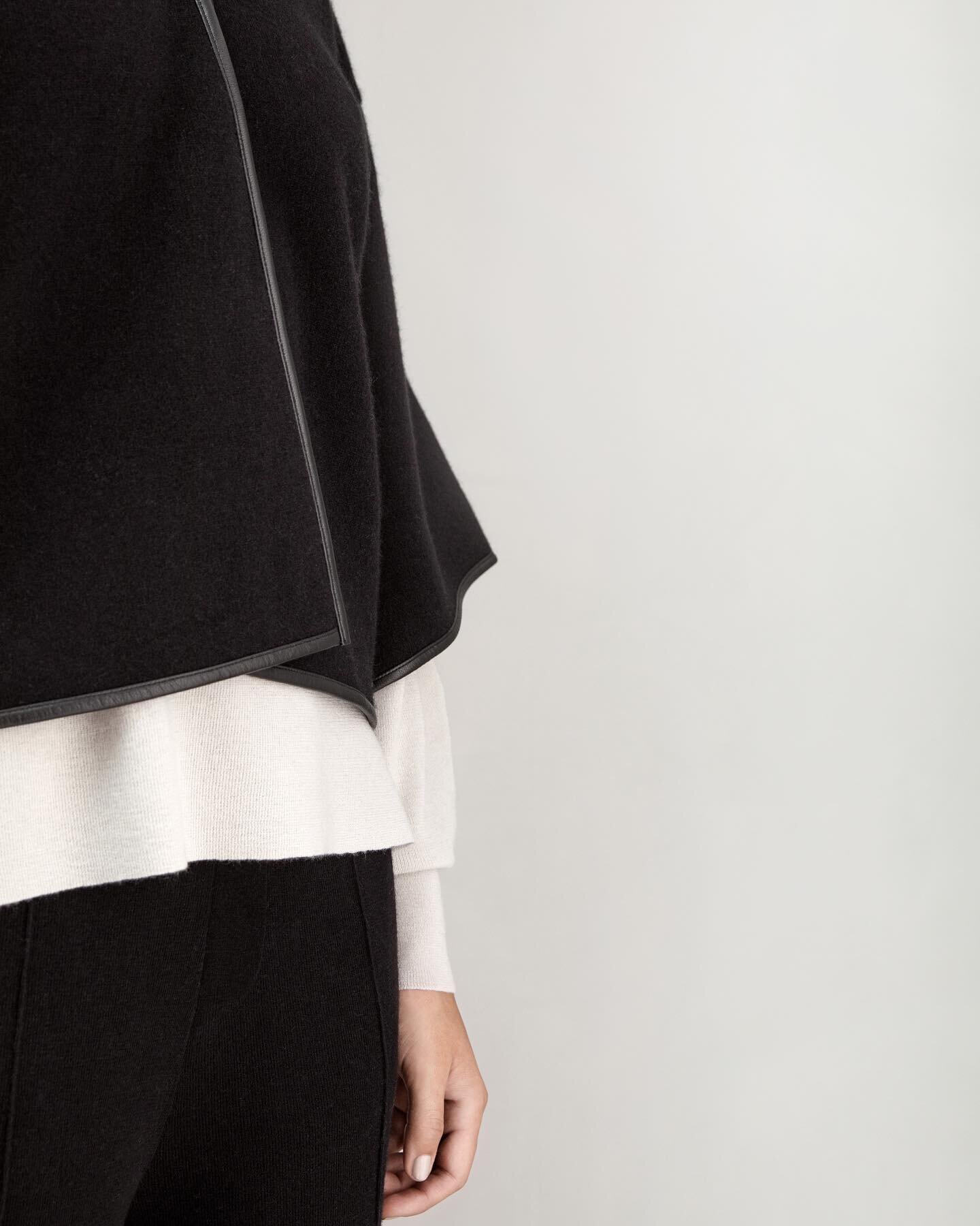 The Essence @moversandcashmere Outlined Cape, crafted with the finest cashmere and outlined with world-class leather @sorensenleather, gently sculpting our everyday move.