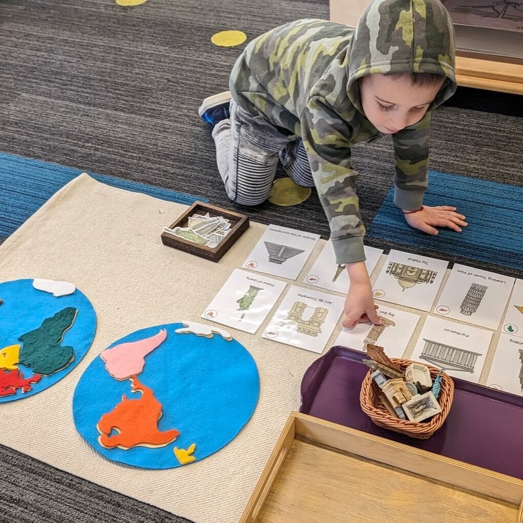 A student in the Yellow Room (primary) works with the continent map to match monuments to their locations all over the world! #exploretheworld #montessorinow #montessoriprimary