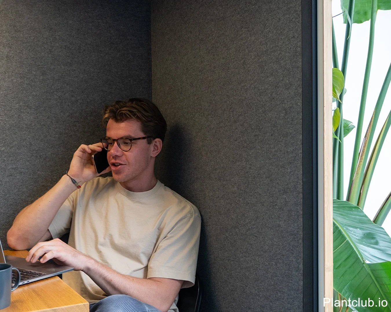  Find your calm in this modern office quiet space with lush plants. 