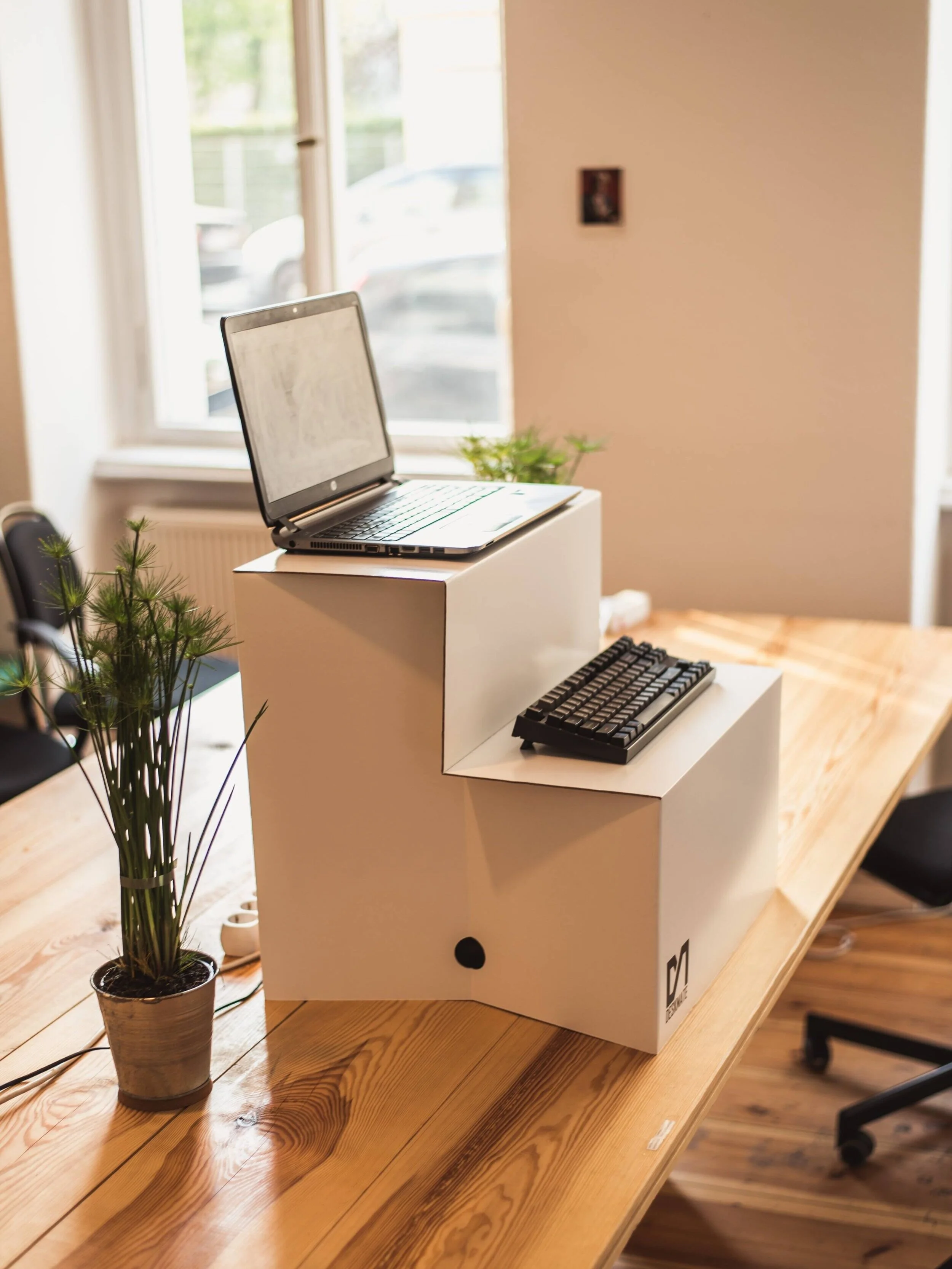  No need to invest in a standing desk. There are solutions that help you modify the desk you already have. 
